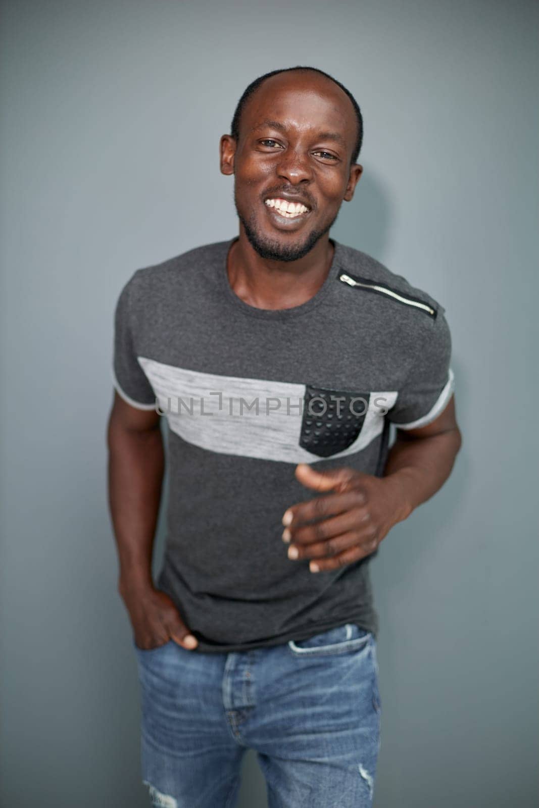 Portrait of an attractive cool guy on a gray background