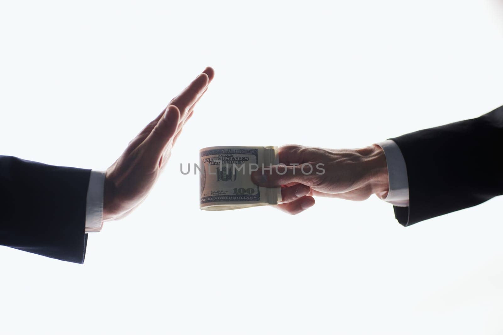 men's hand is giving money another hand on white background. by Prosto