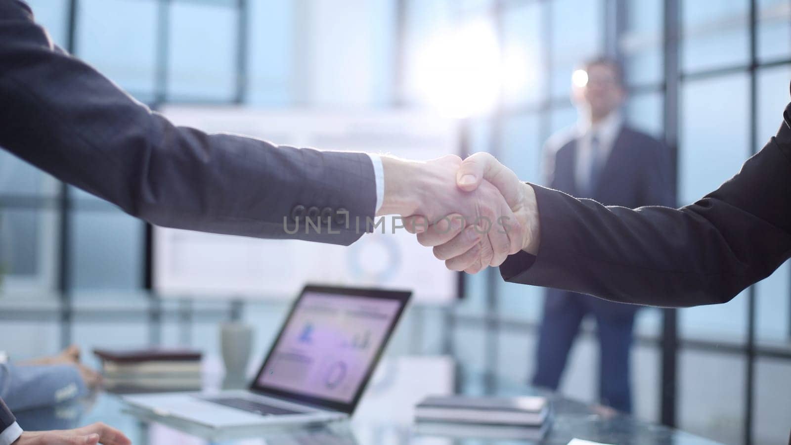 Businessmen at the conference signing a successful contract.
