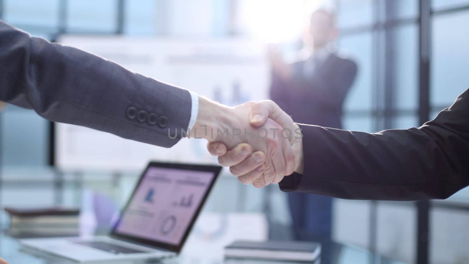 Congratulations and handshake at a successful business meeting.