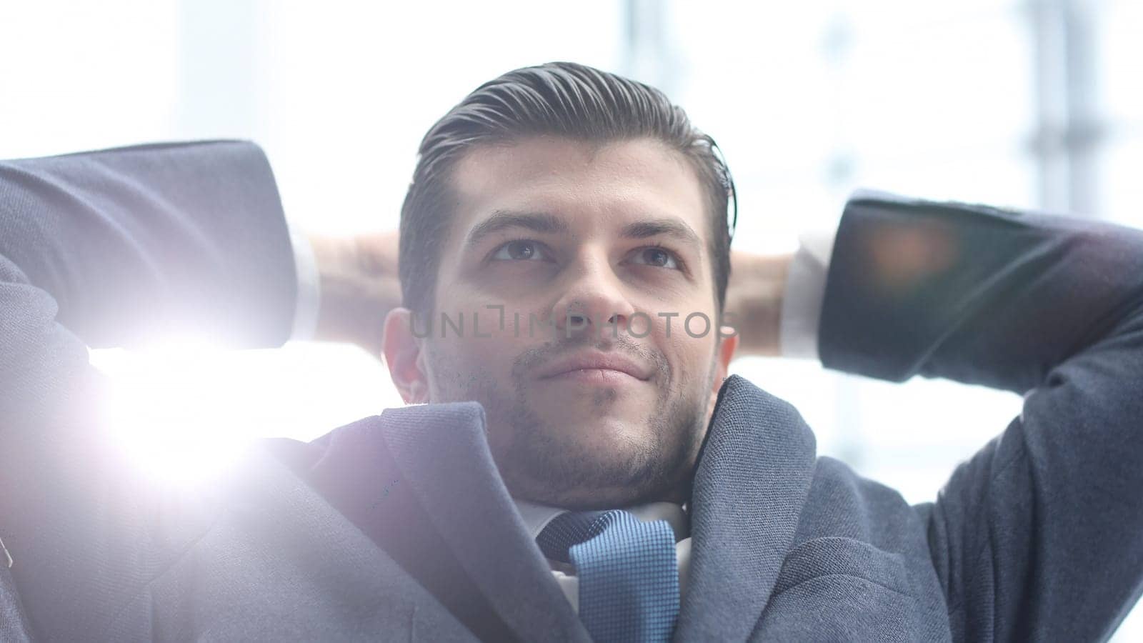 A male businessman is dreaming in close-up by Prosto