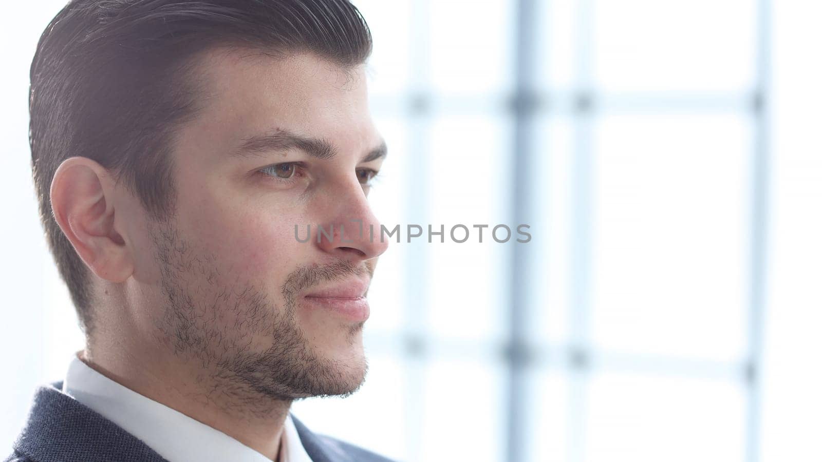 A businessman man working in the office in close-up.