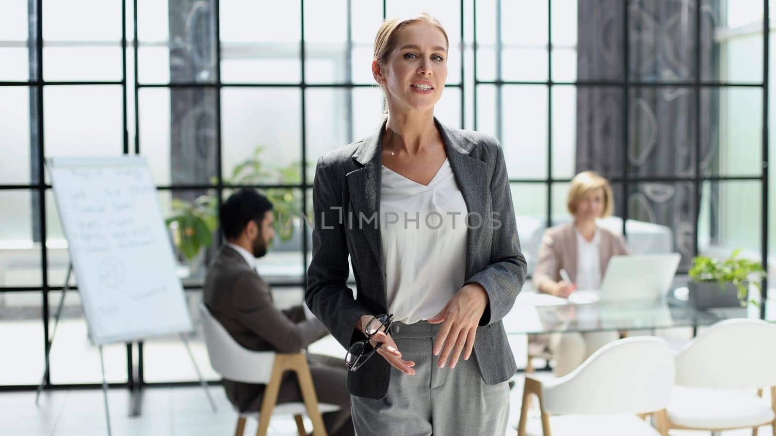 business woman makes a report on a stand in a modern office
