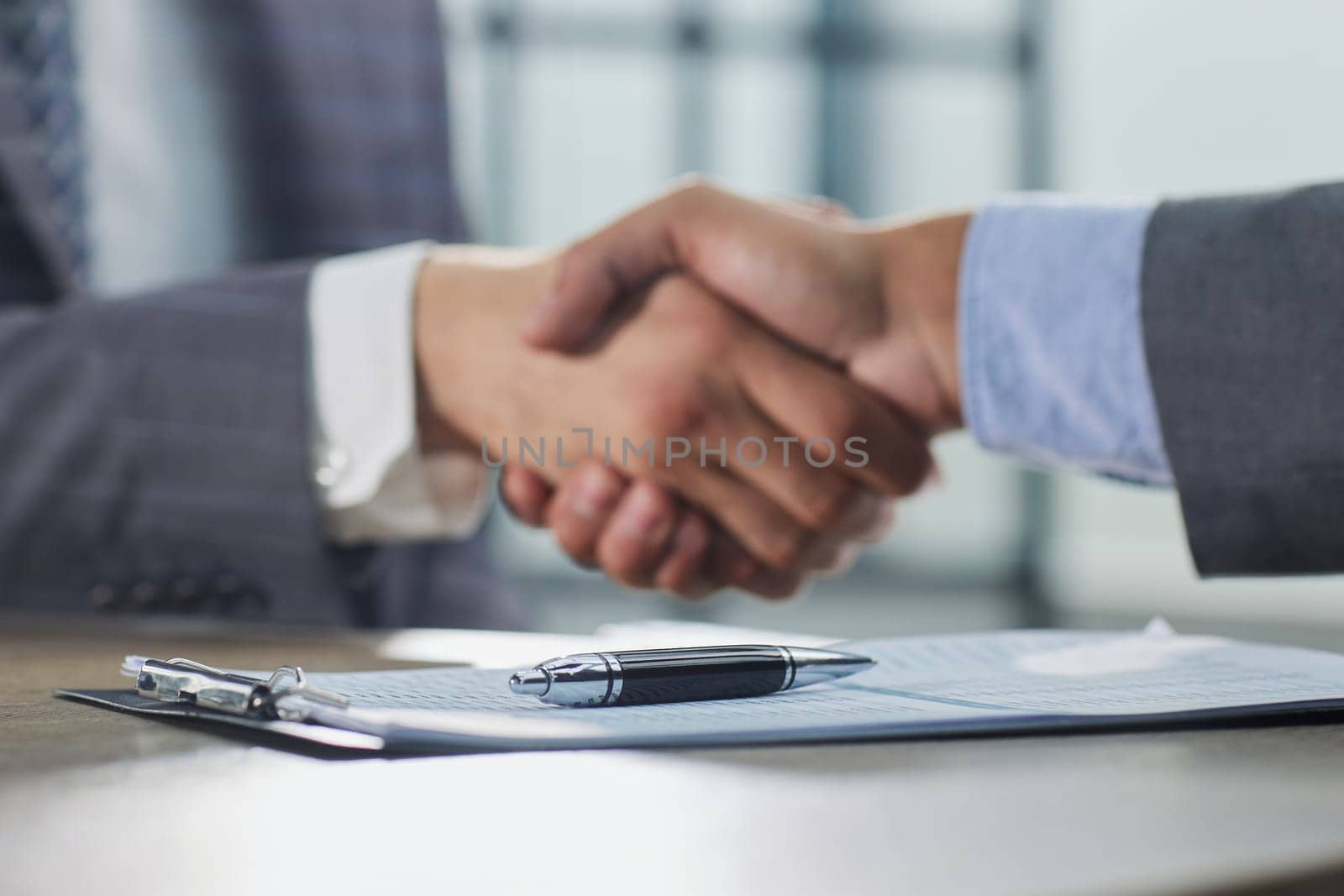 Close up of handshake in the office