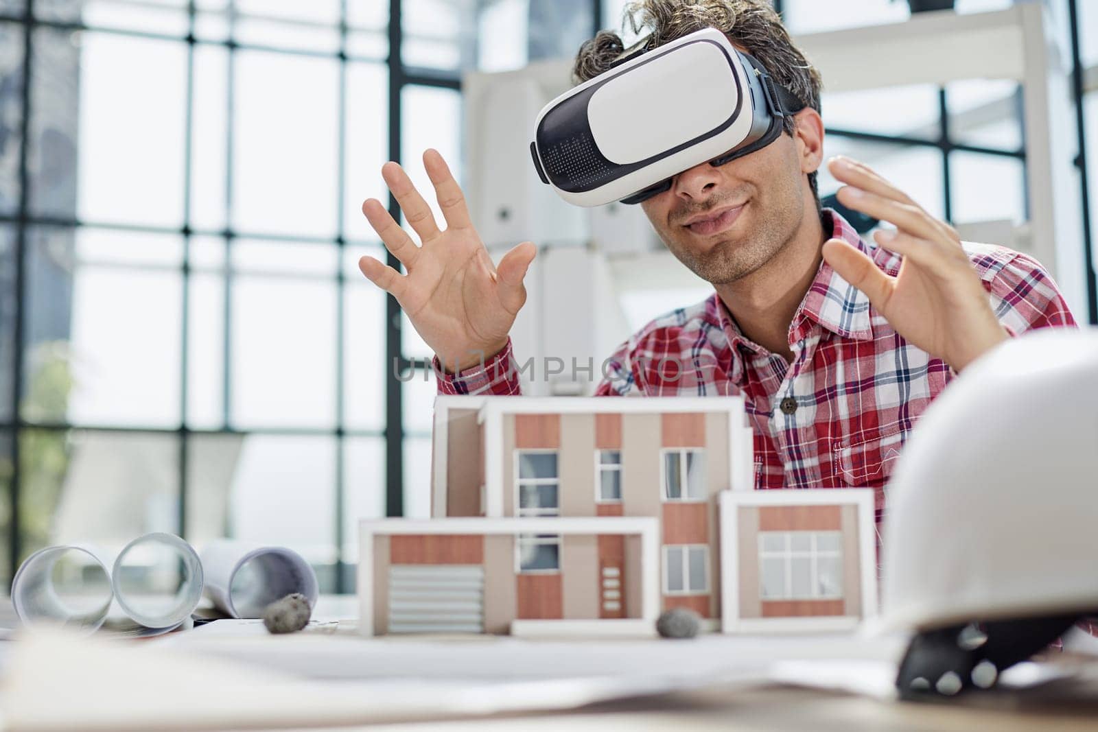 Virtual reality futuristic design technology. Architect or design engineer in VR headset for BIM technology