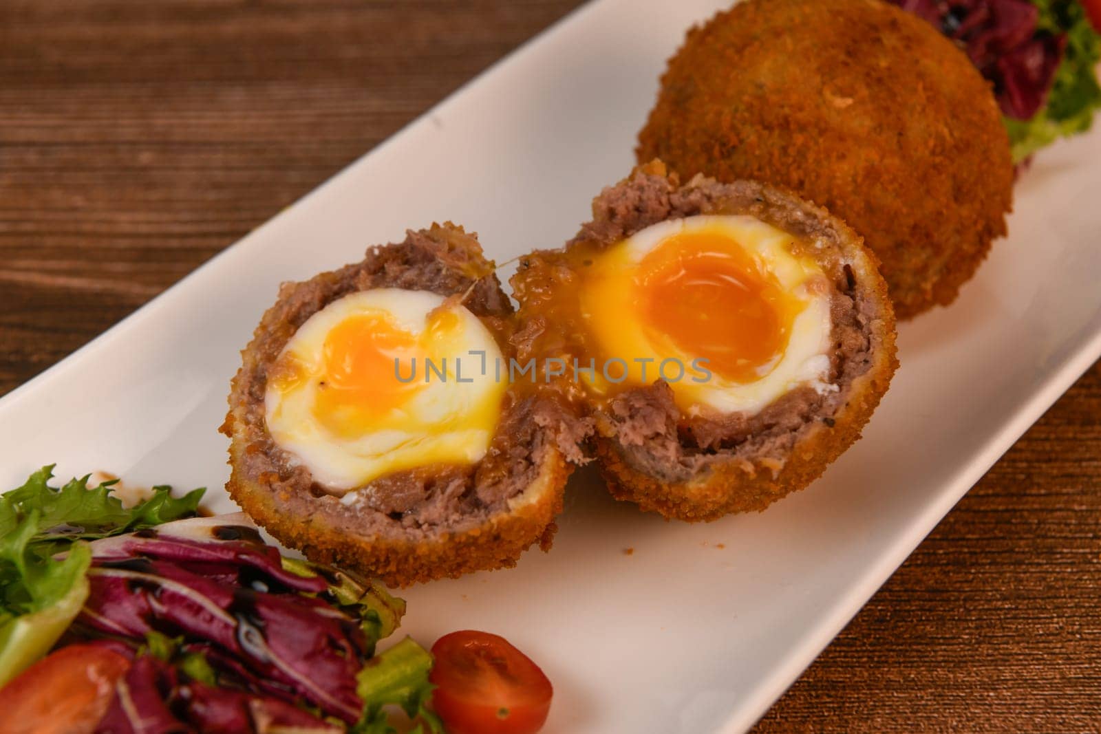 RECIPE FOR BREADED BEEF MEATBALLS STUFFED WITH A SOFT BOILED EGG by FreeProd