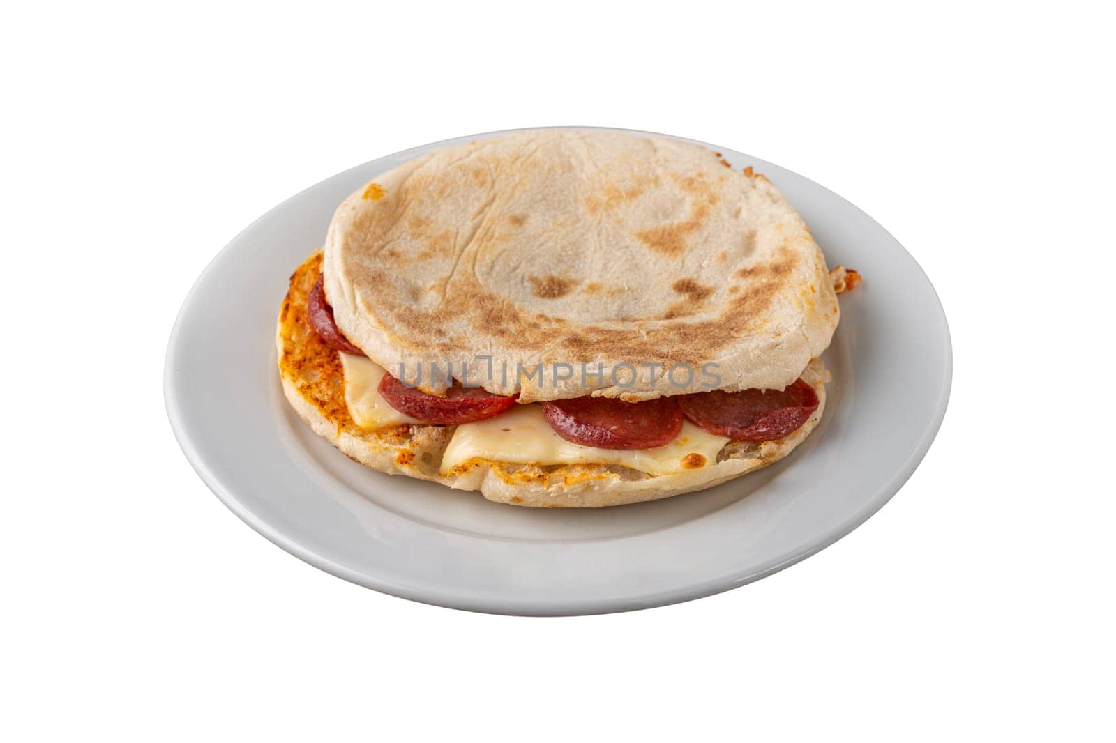 Flatbread toast with salami, turkish sausage and cheddar on white background by Sonat