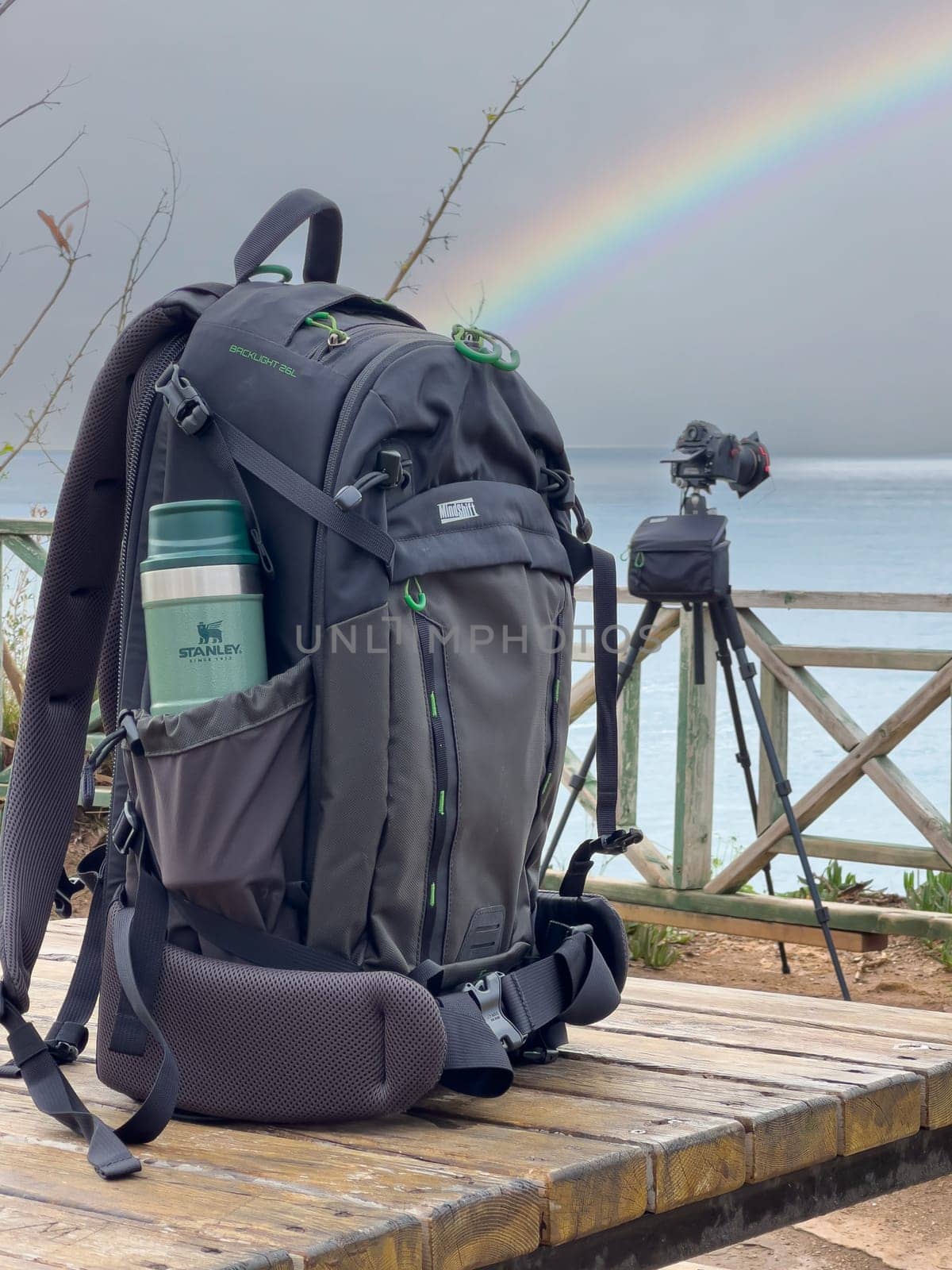 Antalya, Turkey - February 9, 2024: Stanley Action Trigger stands next to traveler's backpack