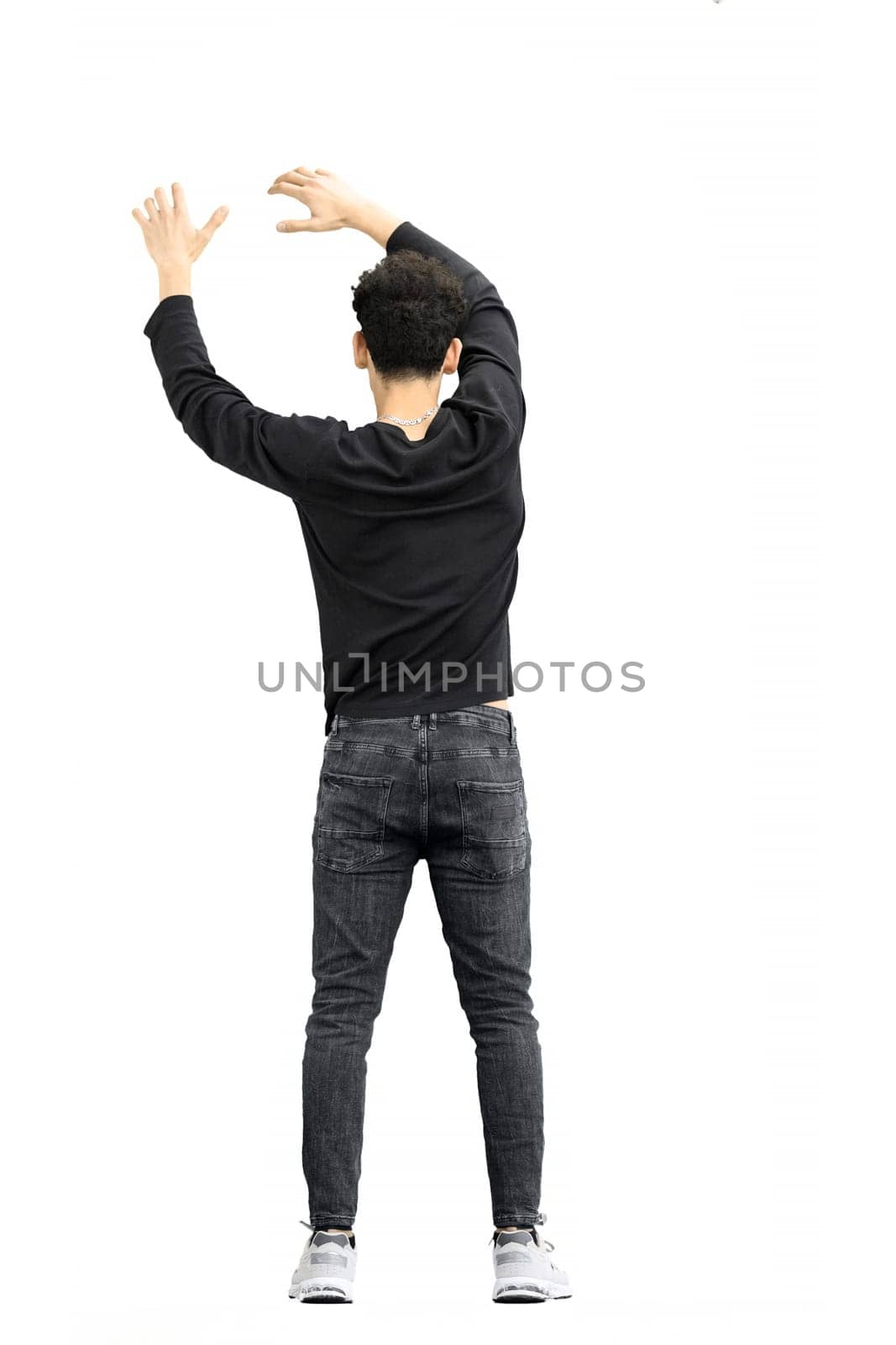 A man, on a white background, in full height, waving his arms.