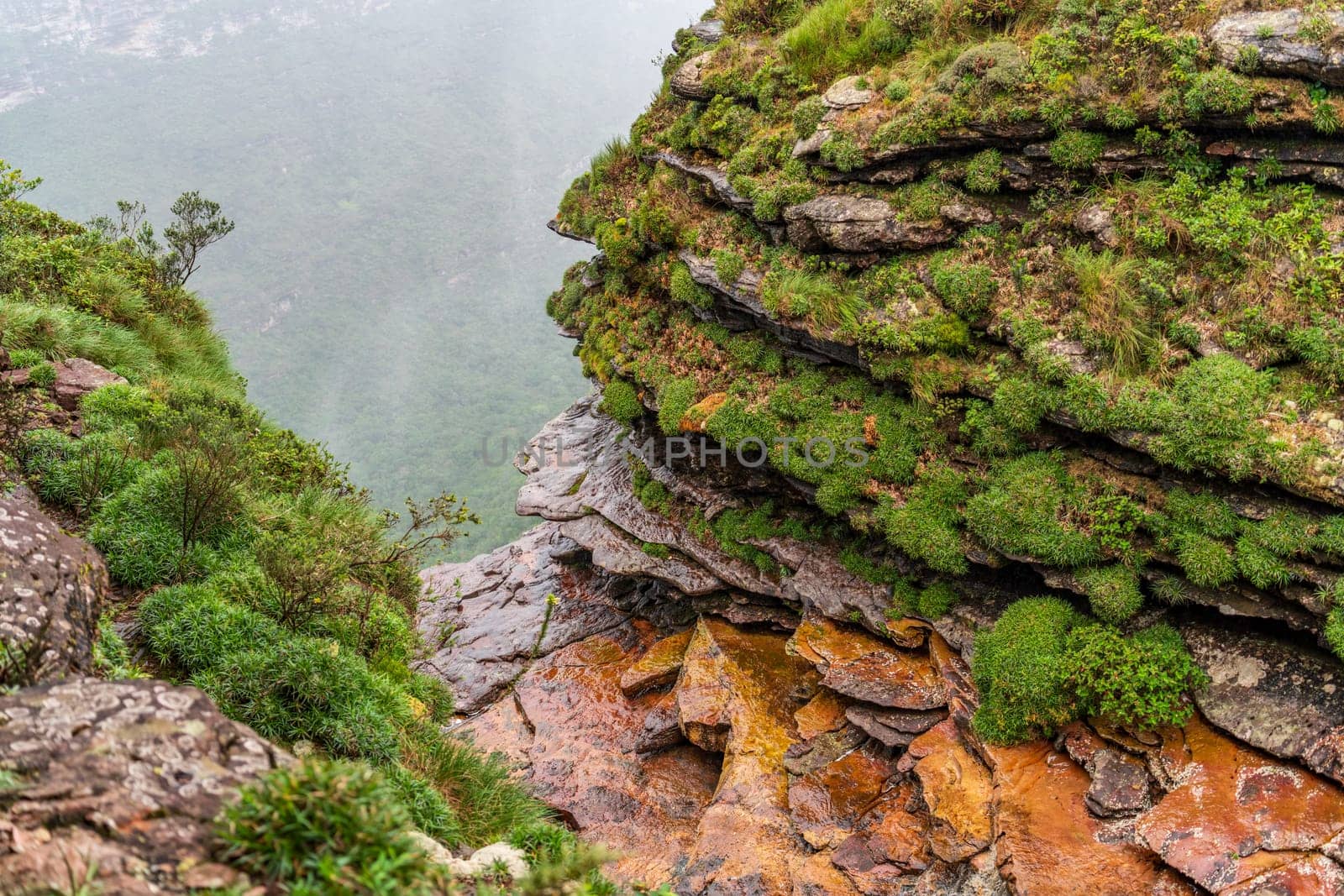 Fumaca Falls in Chapada Diamantina feature a slim cascade plunging into a valley.