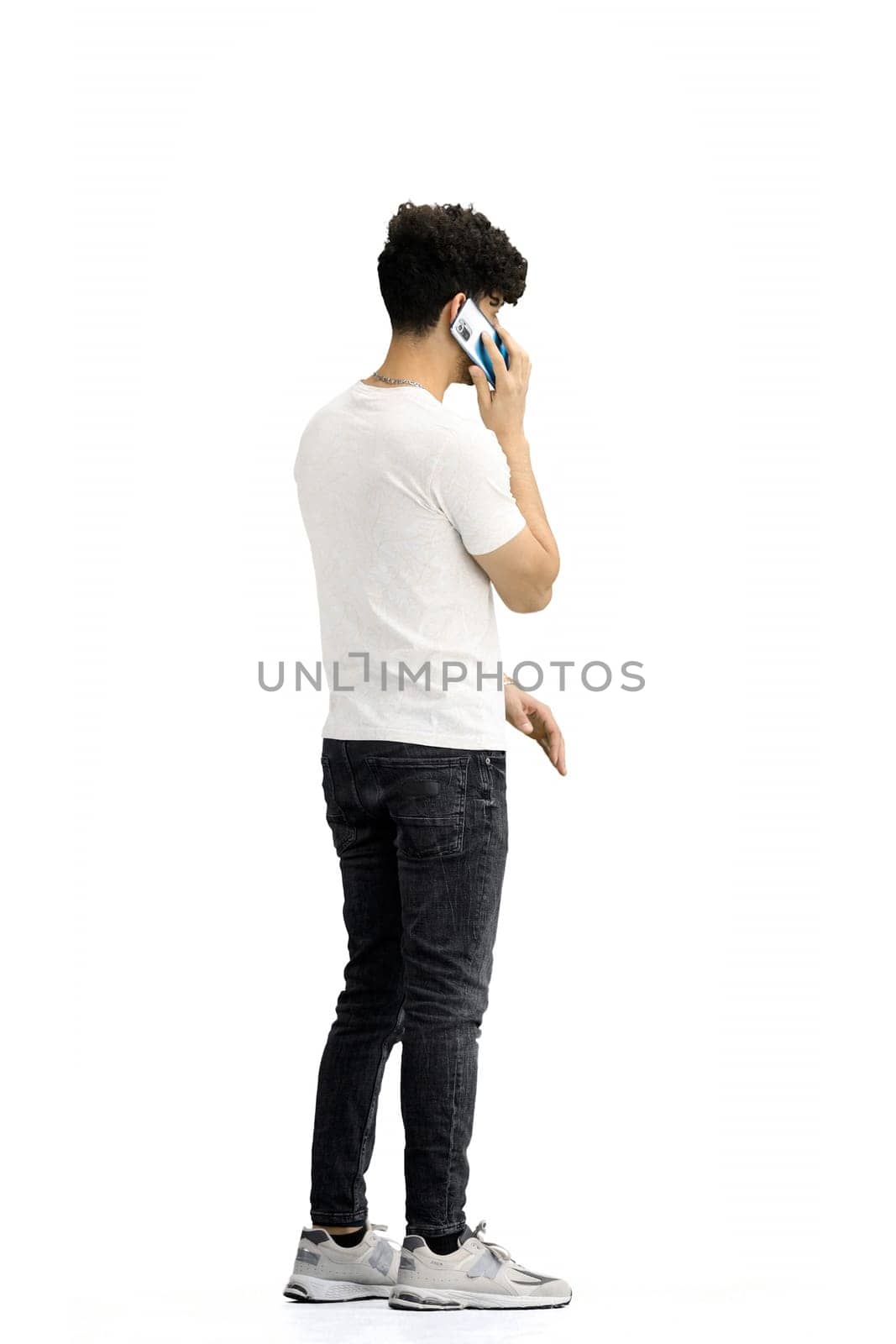 A man, on a white background, in full height, with a phone by Prosto