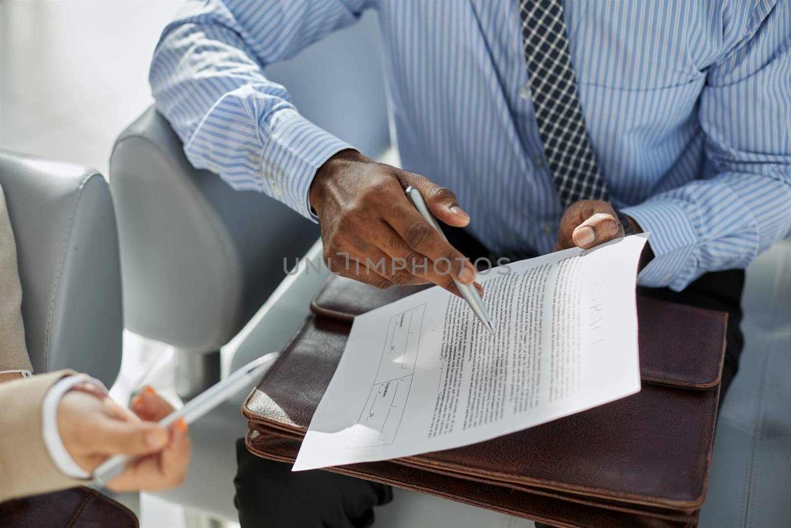 Financial advisor asking for womans signature for insurance, legal paperwork or claim document