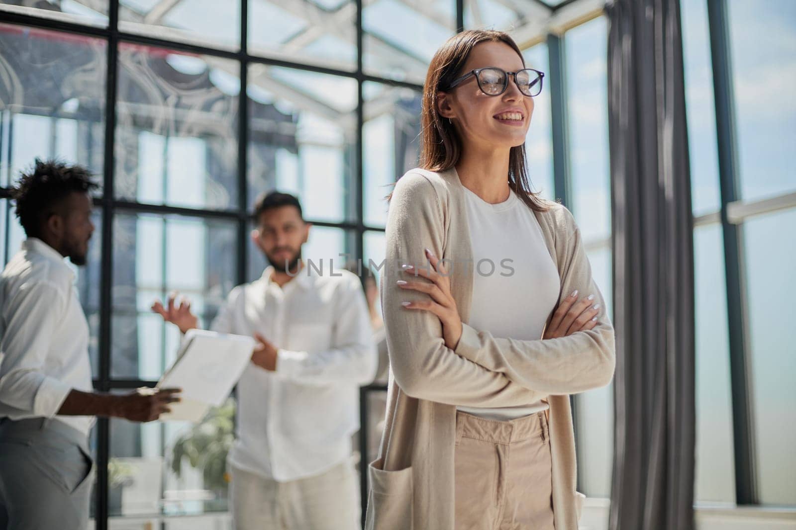 Face of beautiful woman on the background of business people