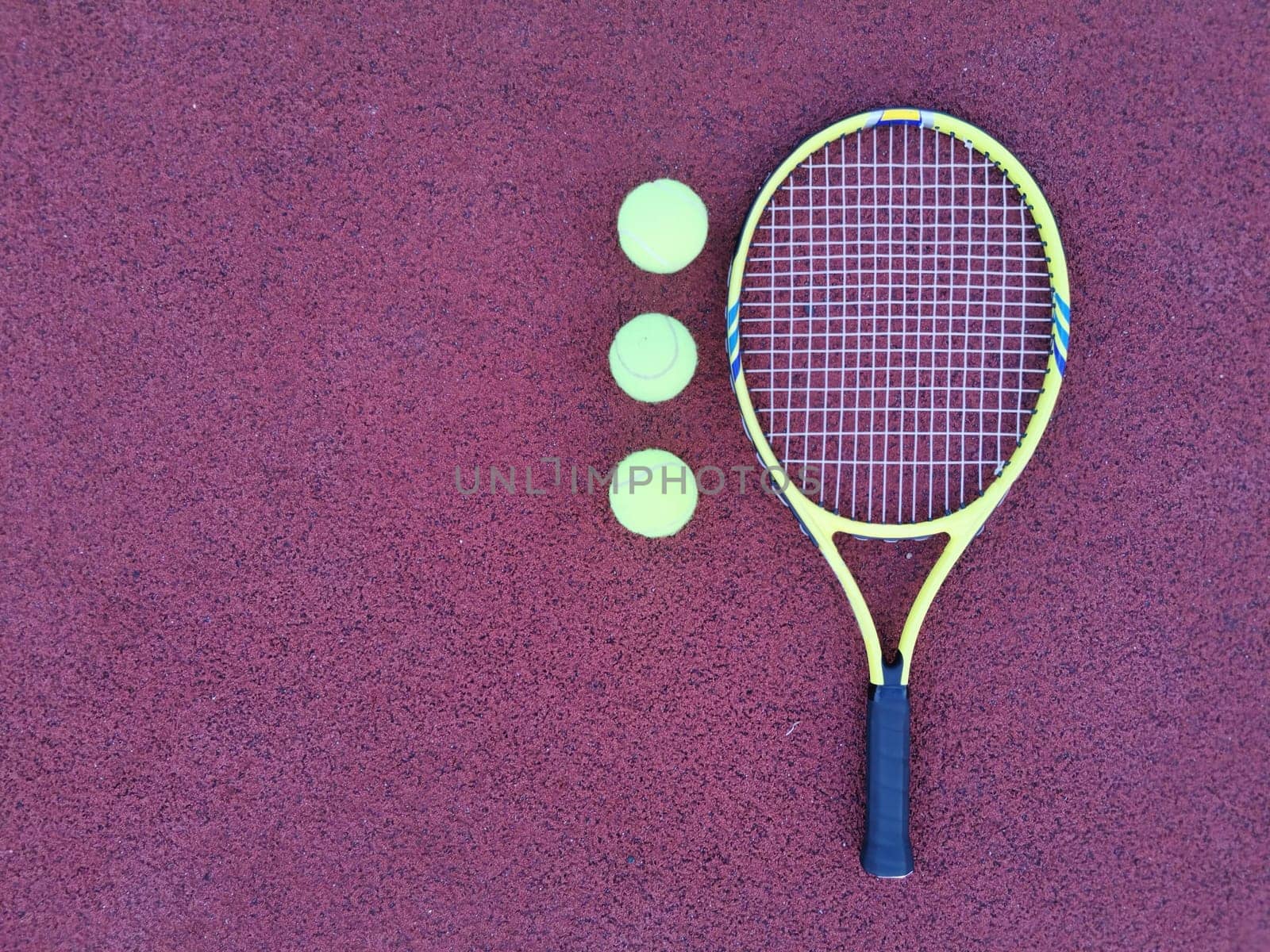 tennis racket with a tennis ball on a tennis court. High quality photo