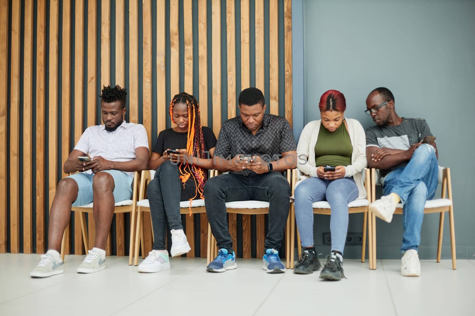 Group of people sleeping on a chair holding smartphones by Prosto