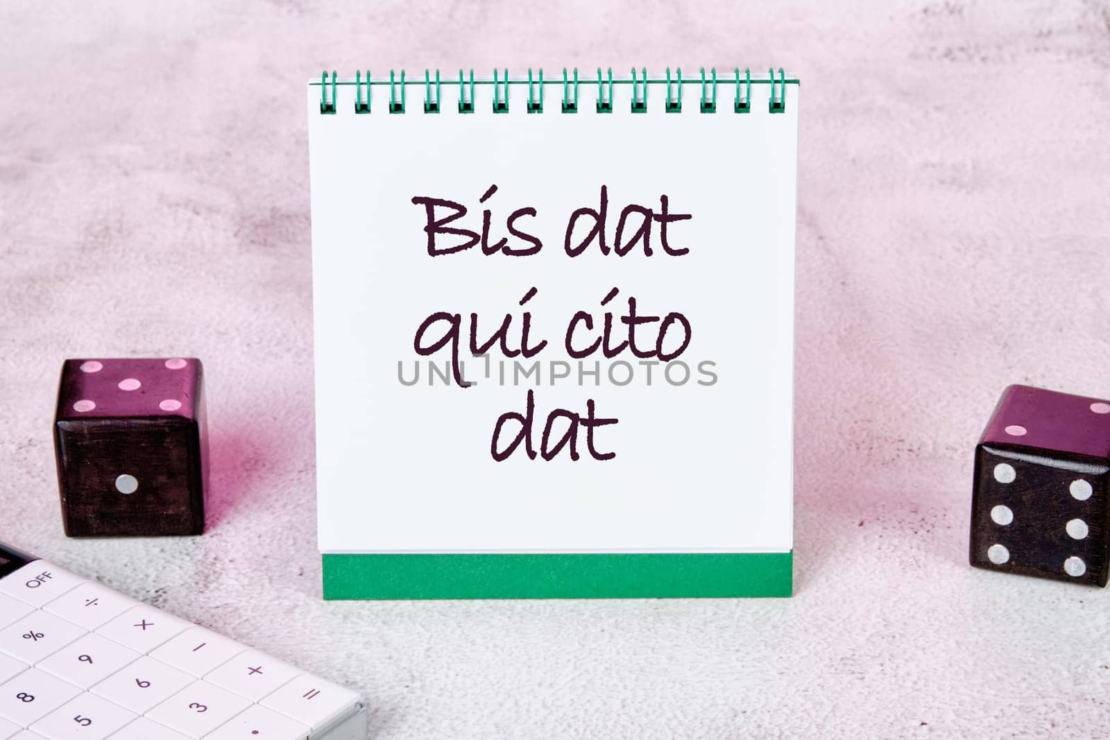 Bis dat qui cito dat It is translated from Latin as The one who gives twice is the one who gives quickly It is written on a white sheet of a notebook