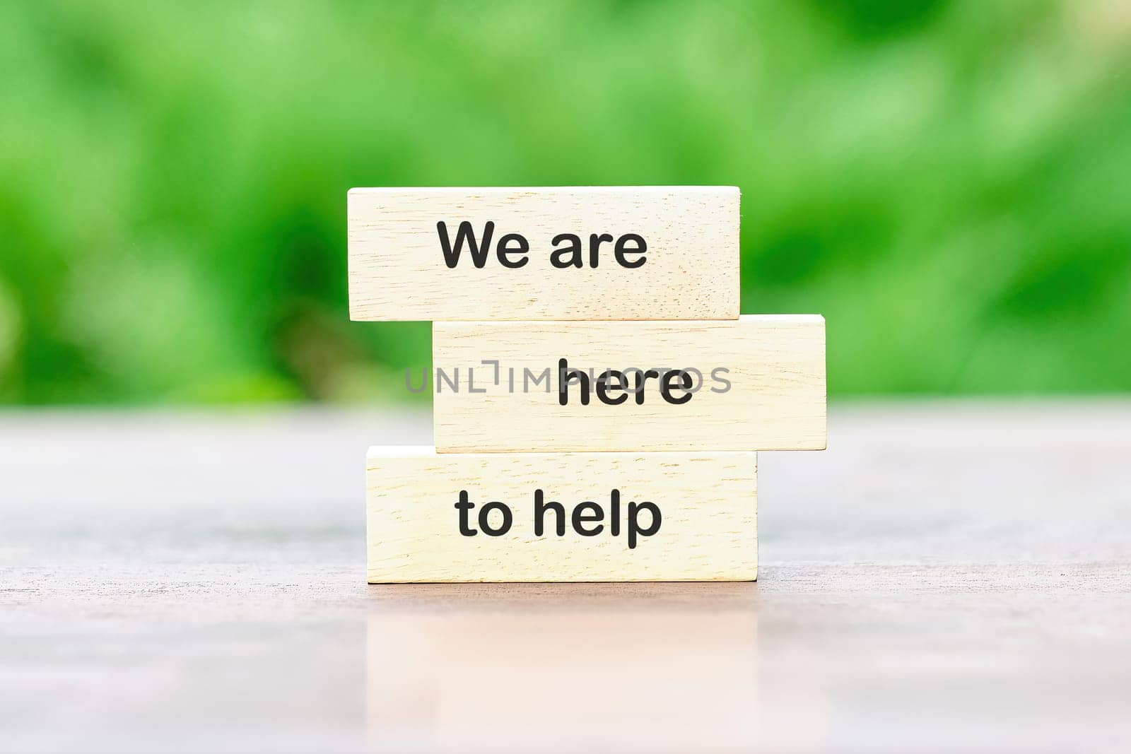 We are here to help, Text written on wooden blocks