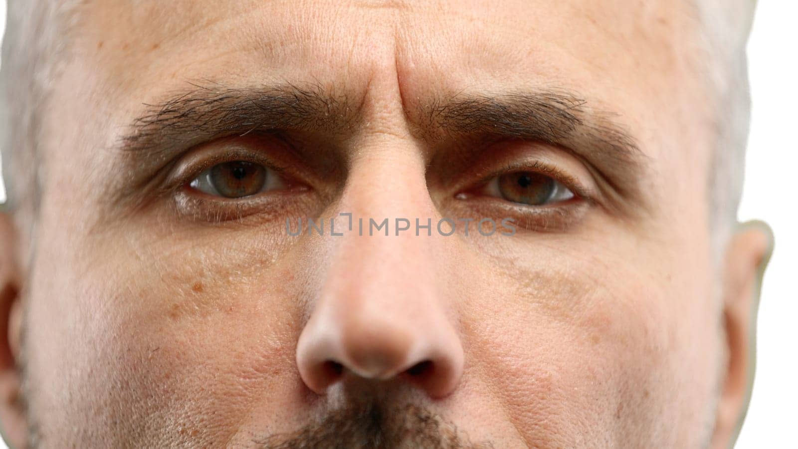 Man's eyes, close-up, on a white background.