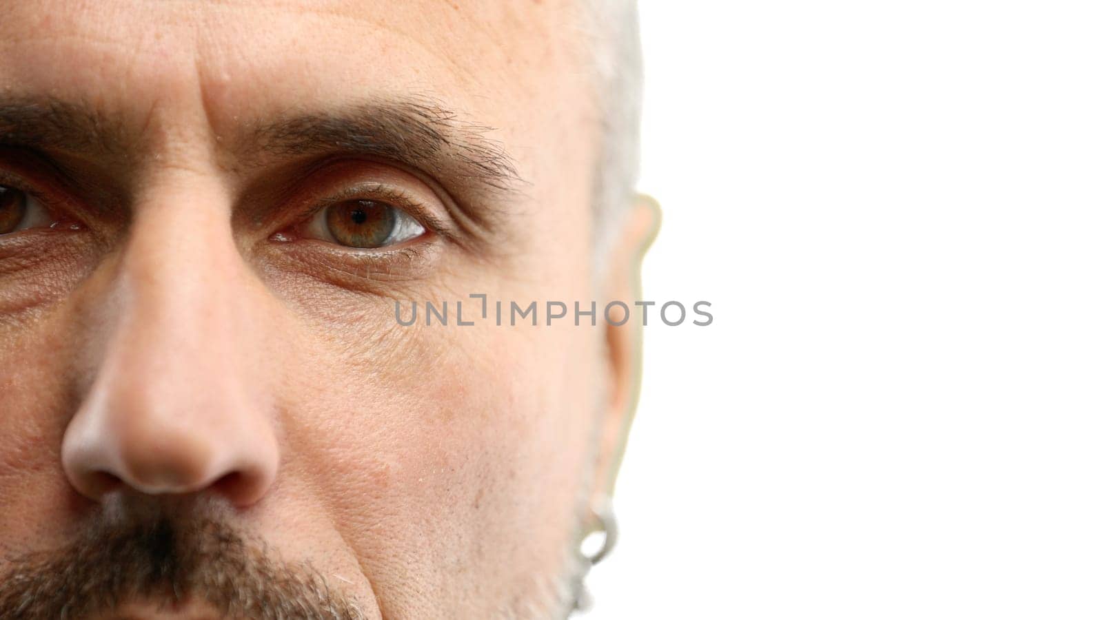 Man's eyes, close-up, on a white background.