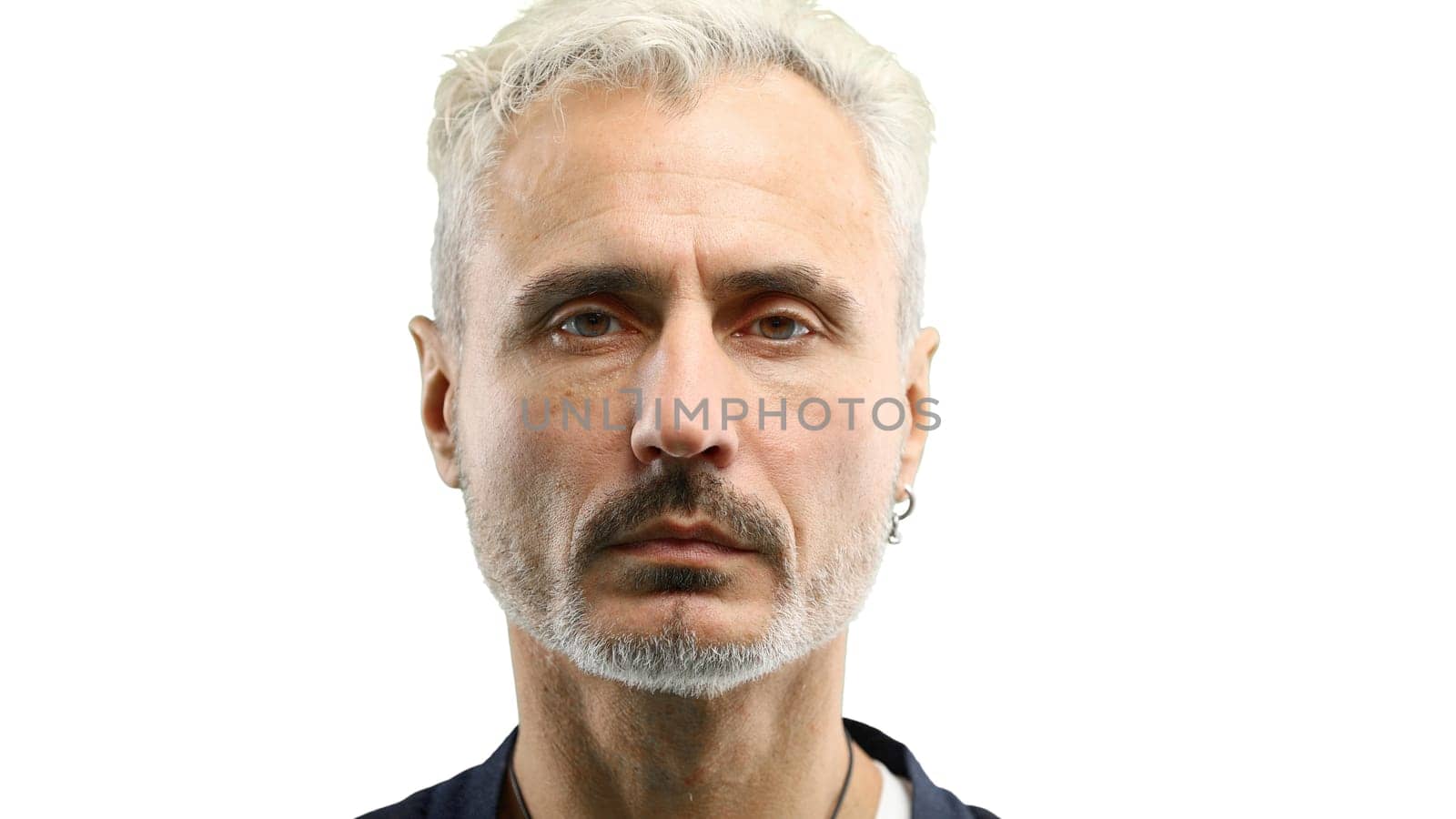 Man's face, in close-up, on a white background.