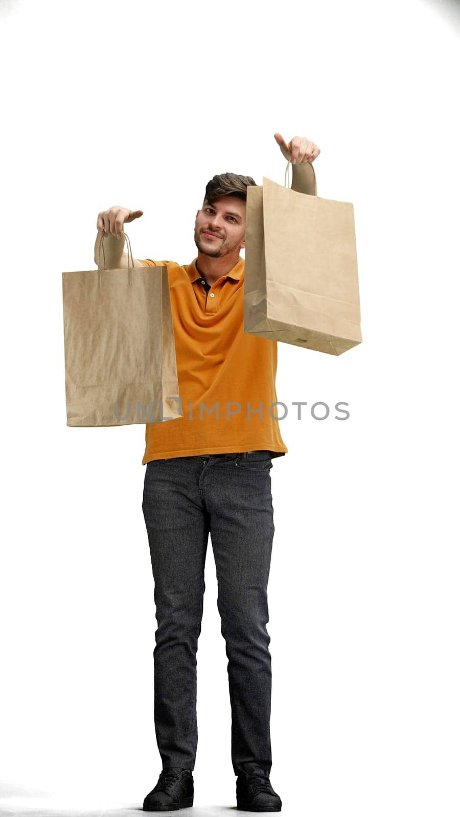 A man, full-length, on a white background, with bags.