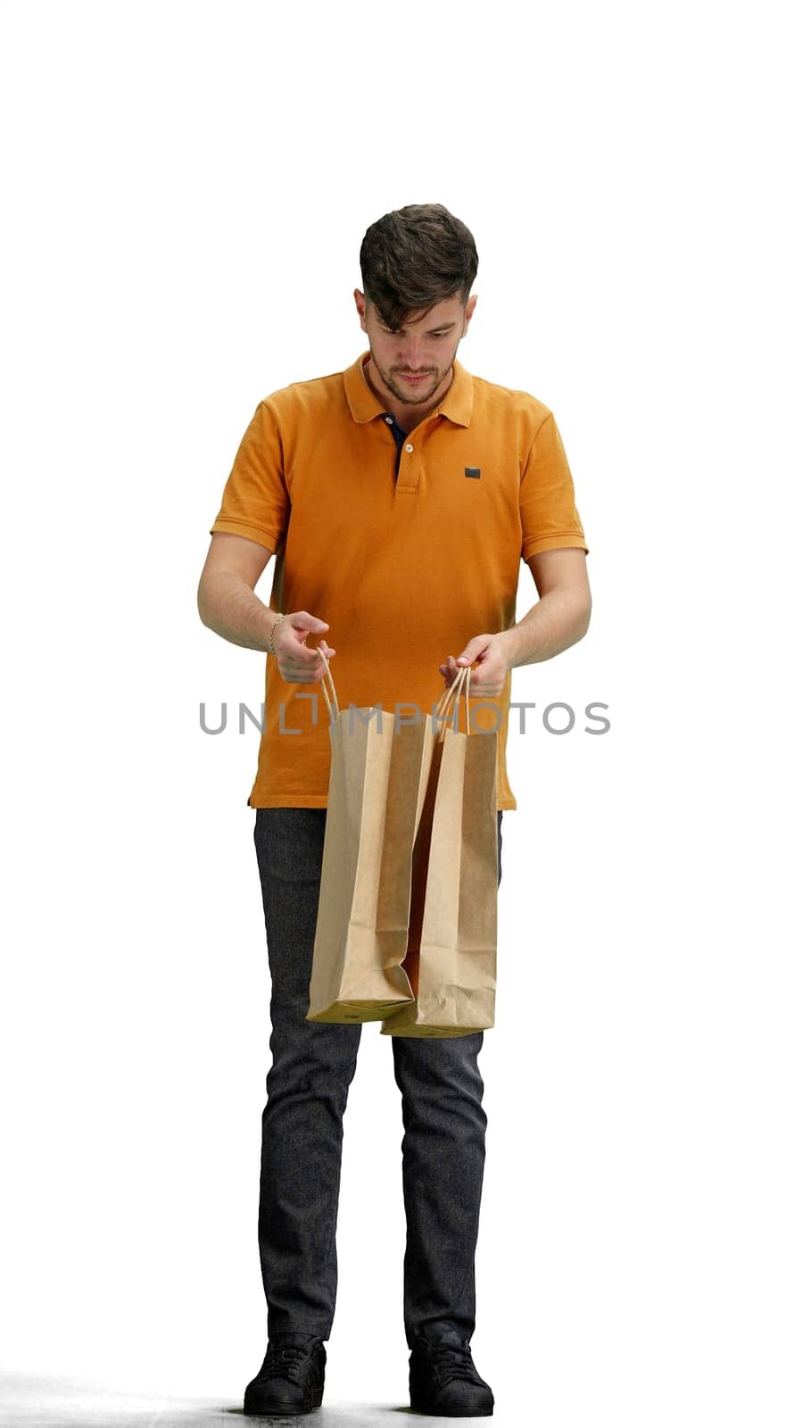 A man, full-length, on a white background, with bags.