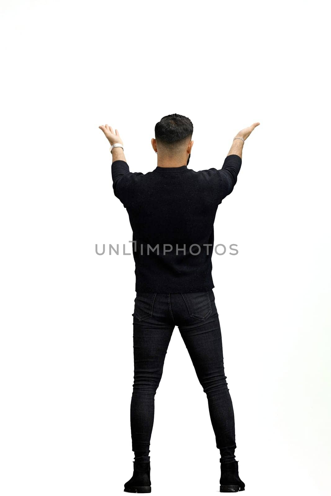 A man, full-length, on a white background, spreads his arms.