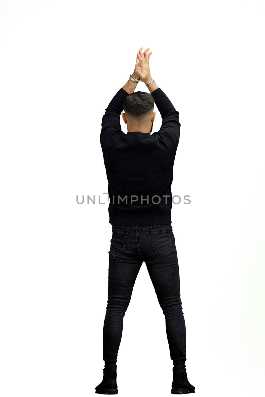 A man, full-length, on a white background, spreads his arms.