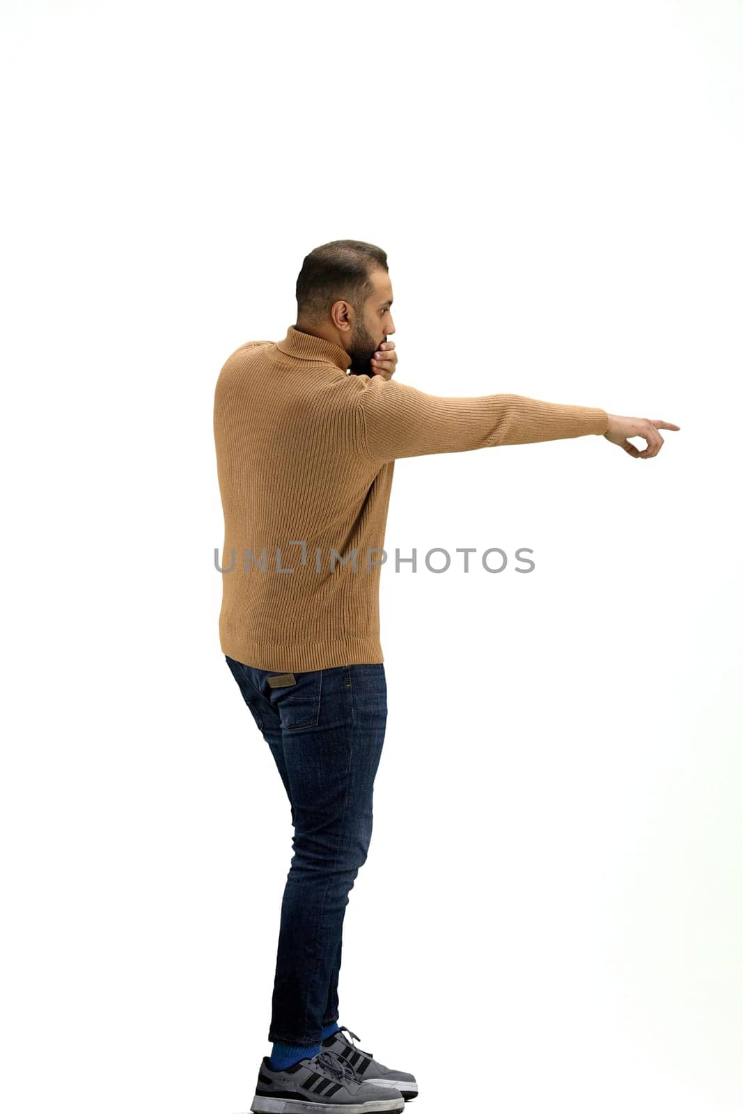 A man, full-length, on a white background, raised his hand up.