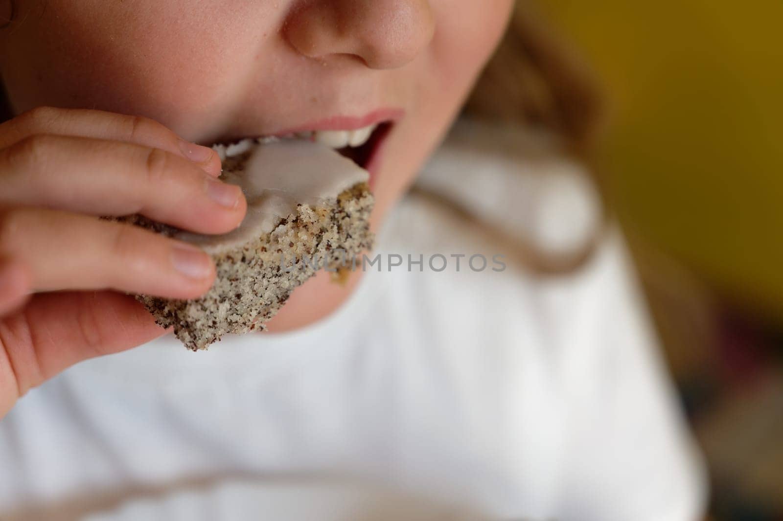 Young girl - child eating candy and sweets. Detail of face and mouth. Concept for healthy lifestyle - healthy - unhealthy sweet food and sugar.