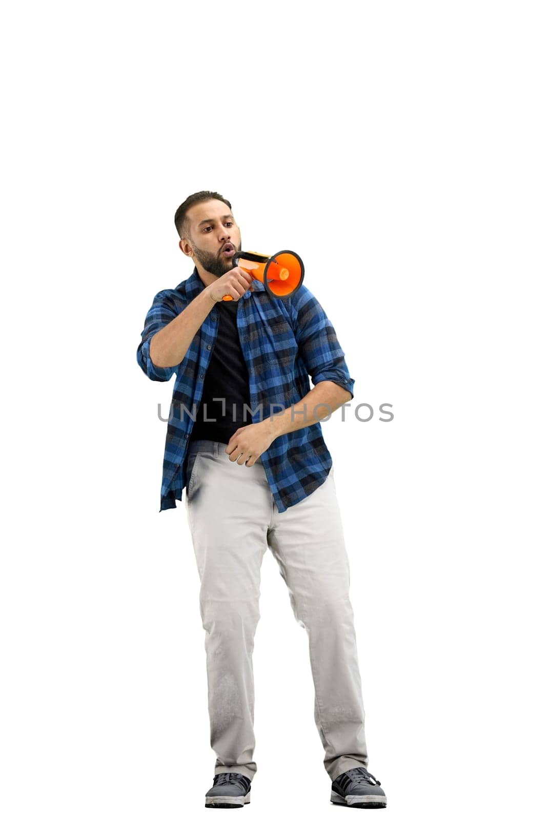 A man, full-length, on a white background, with a megaphone.