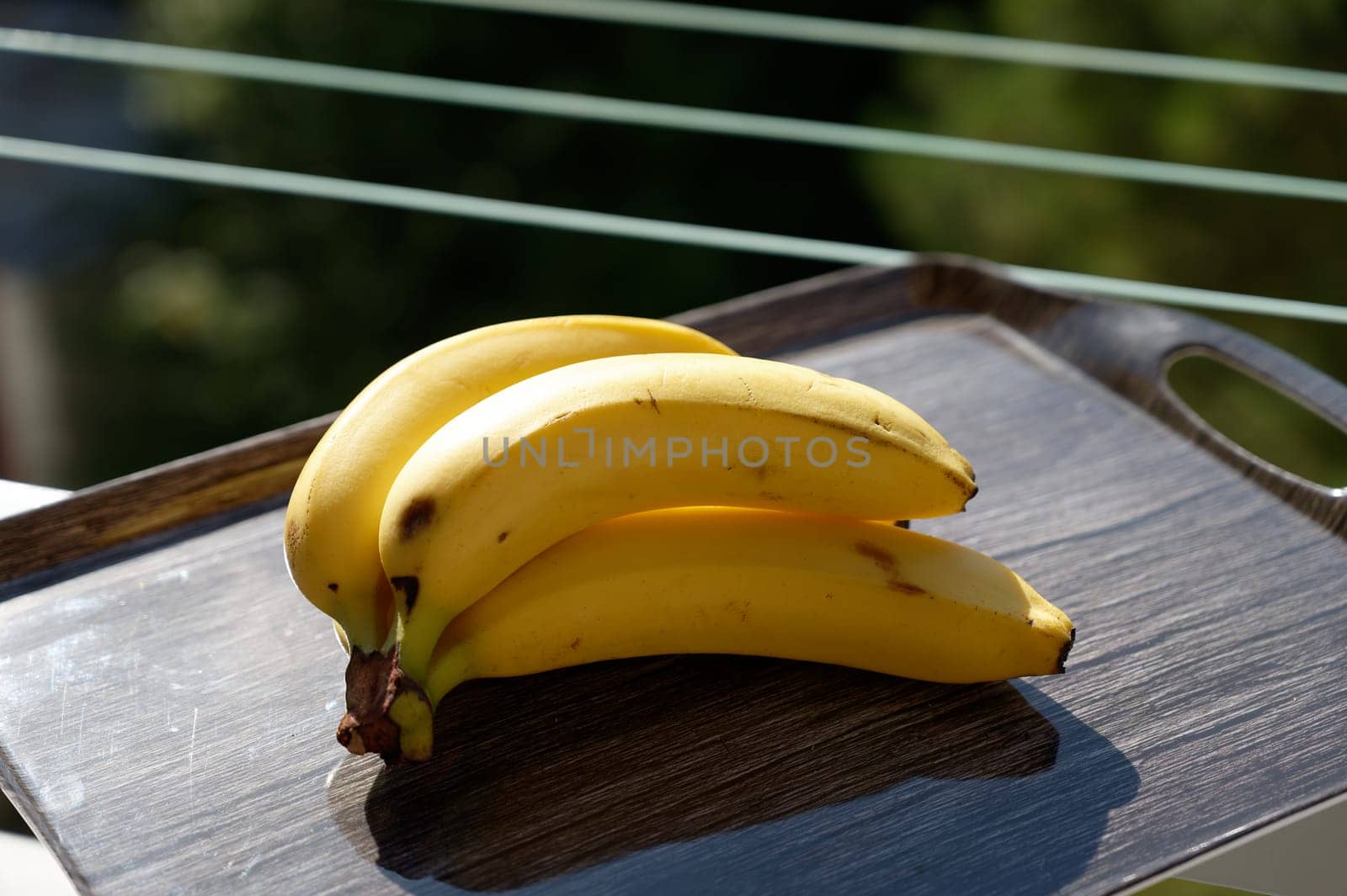 Beautiful fresh yellow banana on the table. Healthy food - fruit for a snack. by Montypeter