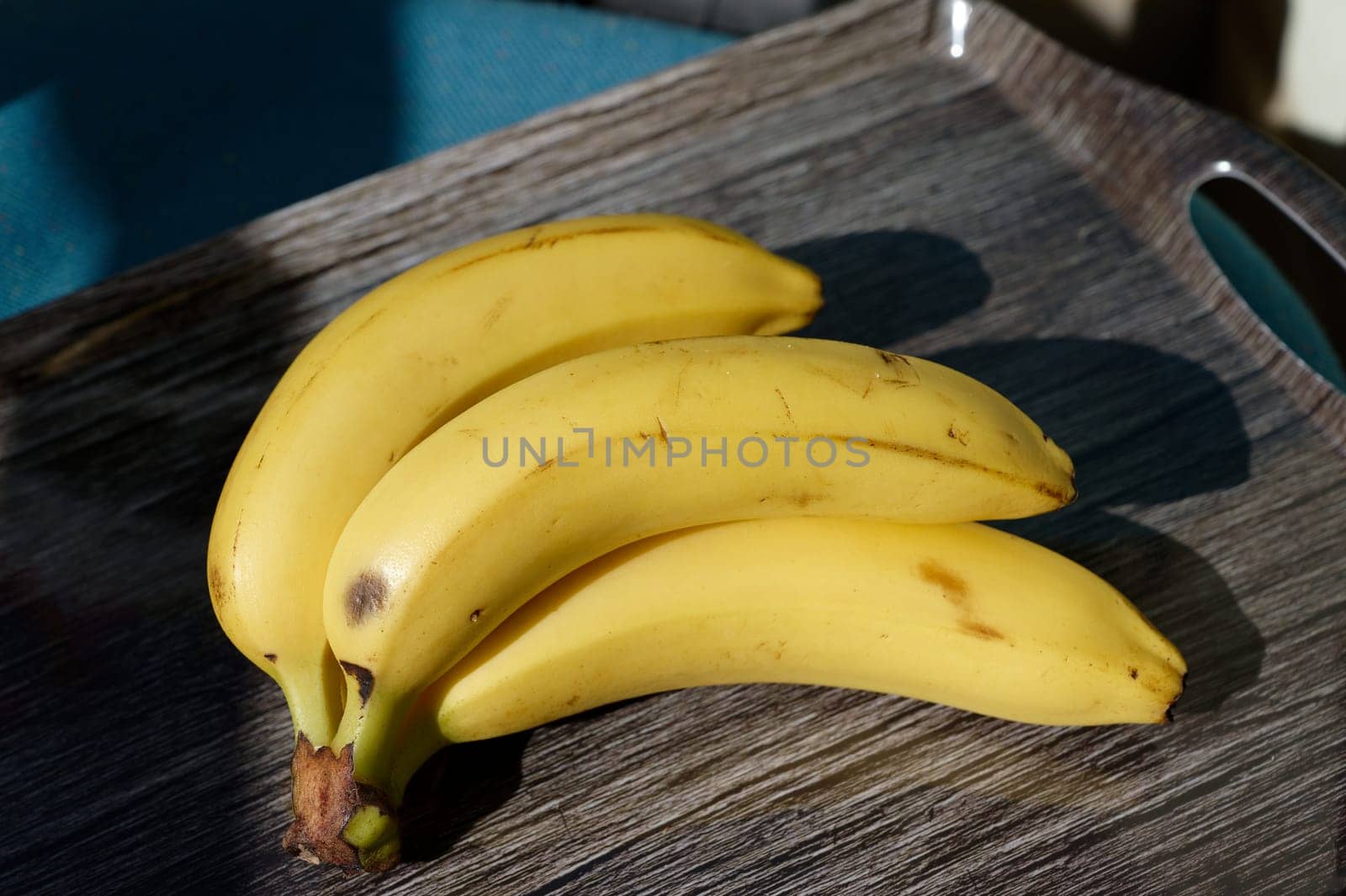 Beautiful fresh yellow banana on the table. Healthy food - fruit for a snack.