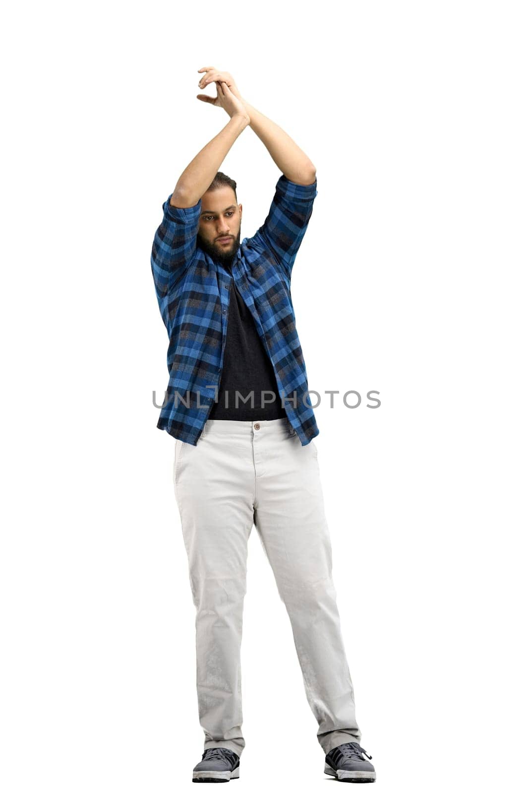 A man, full-length, on a white background, claps.