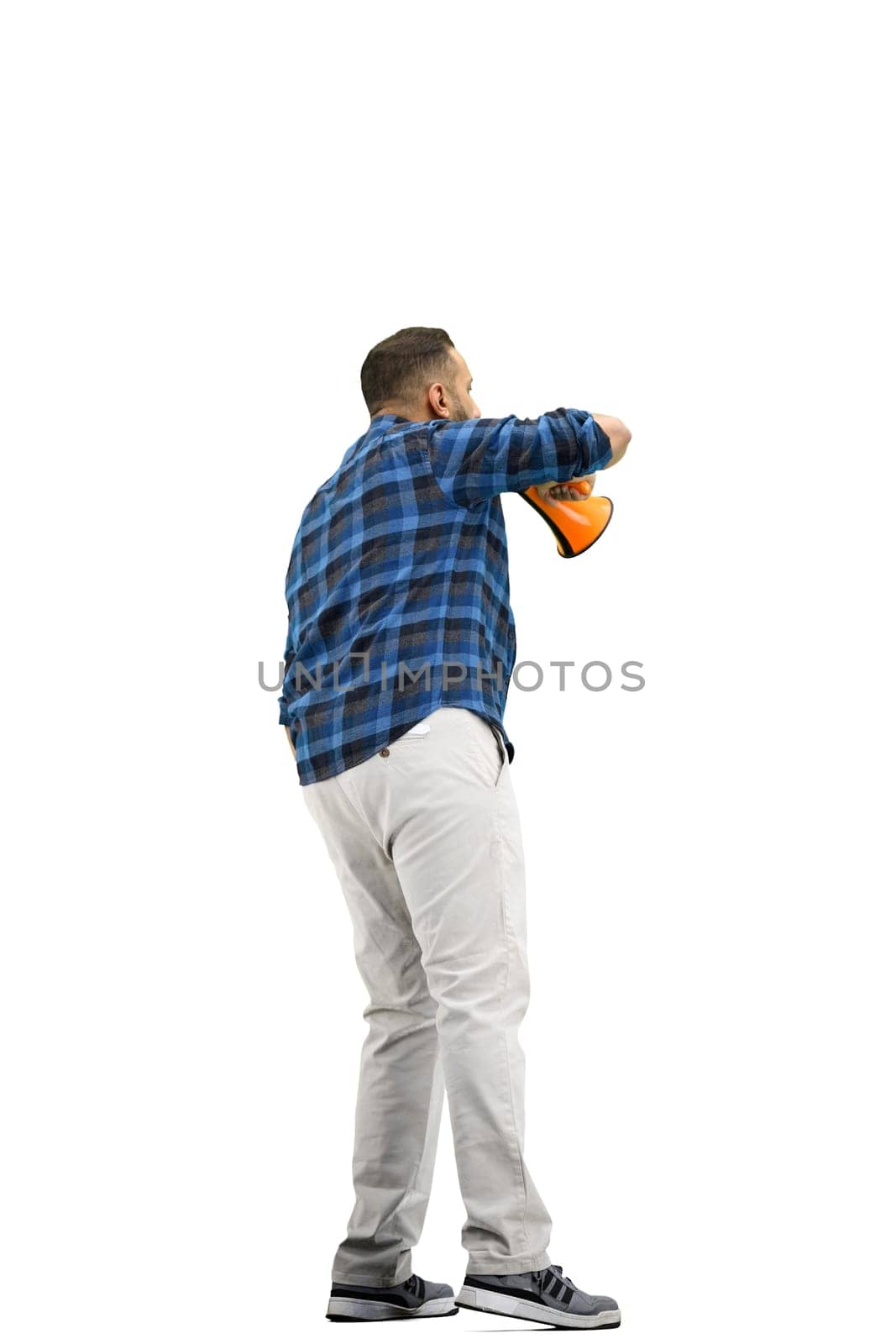 A man, full-length, on a white background, with a megaphone.
