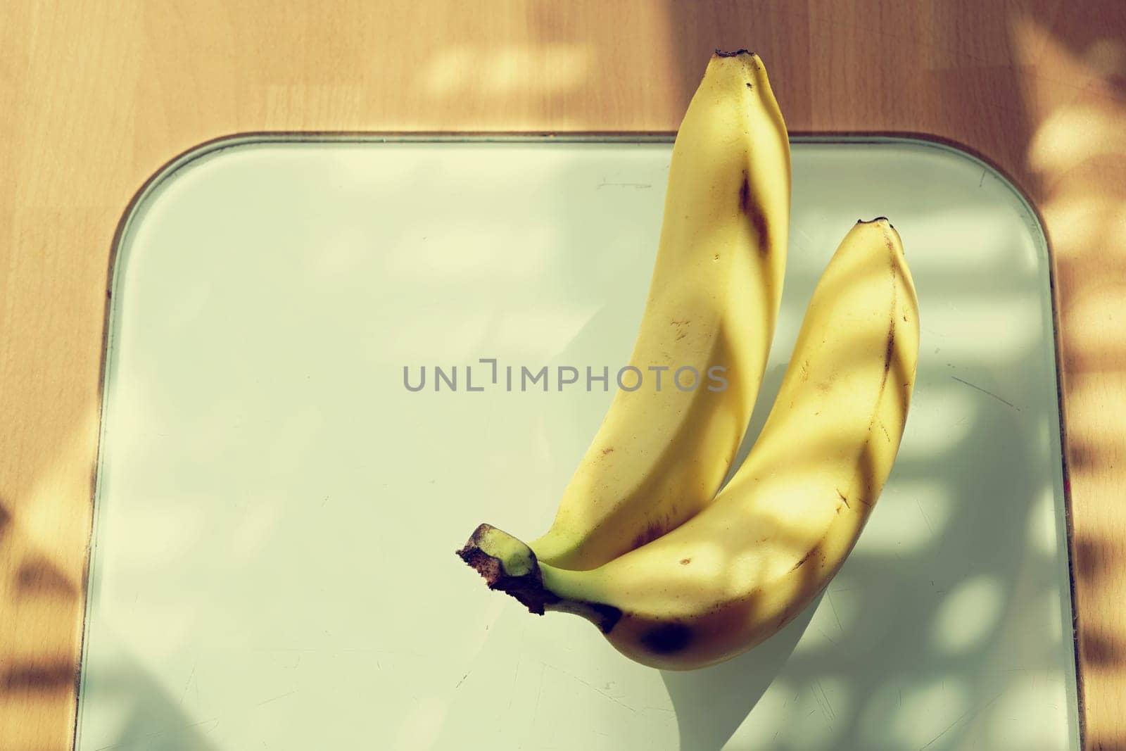 Beautiful fresh yellow banana on the table. Healthy food - fruit for a snack.