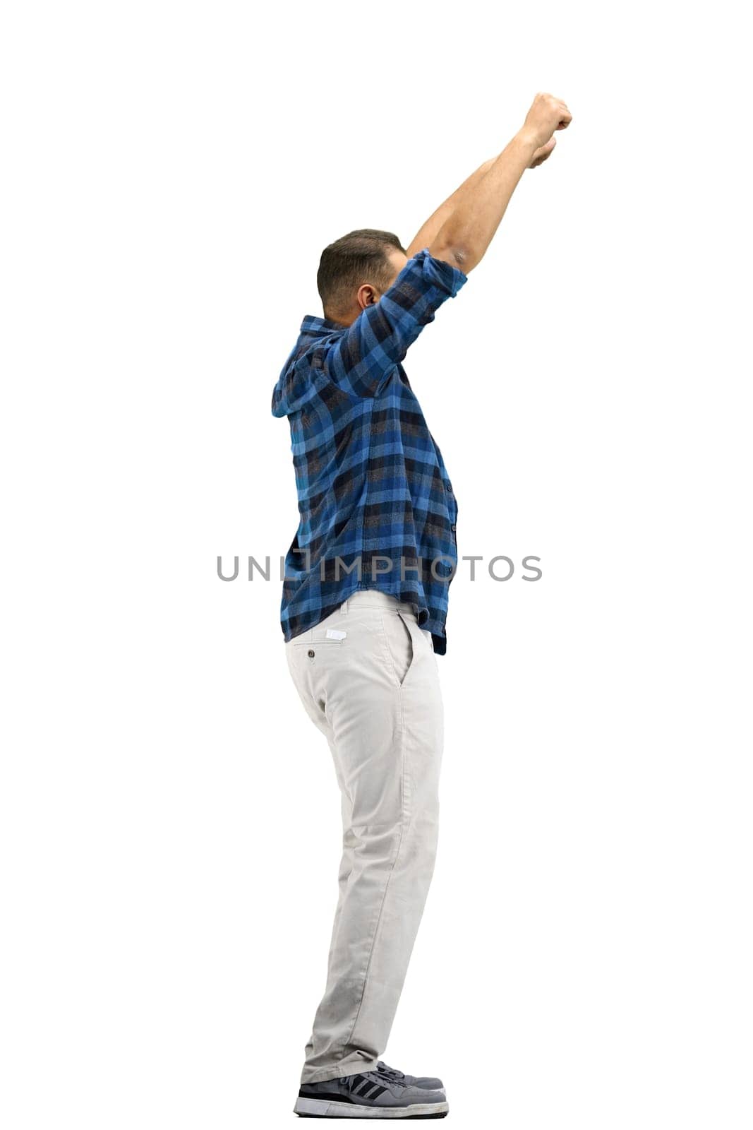 A man, full-length, on a white background, waving his arms.