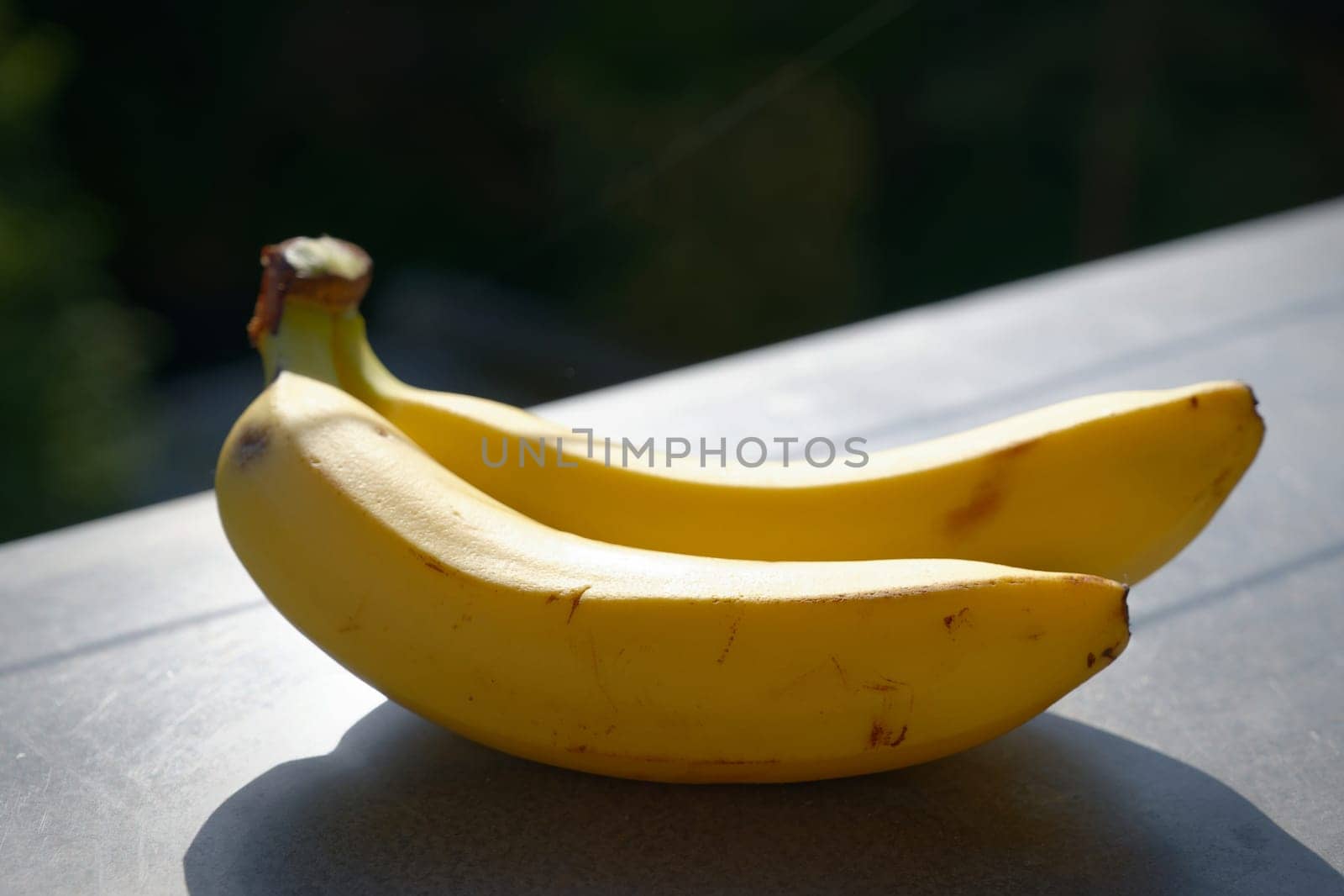 Beautiful fresh yellow banana on the table. Healthy food - fruit for a snack.