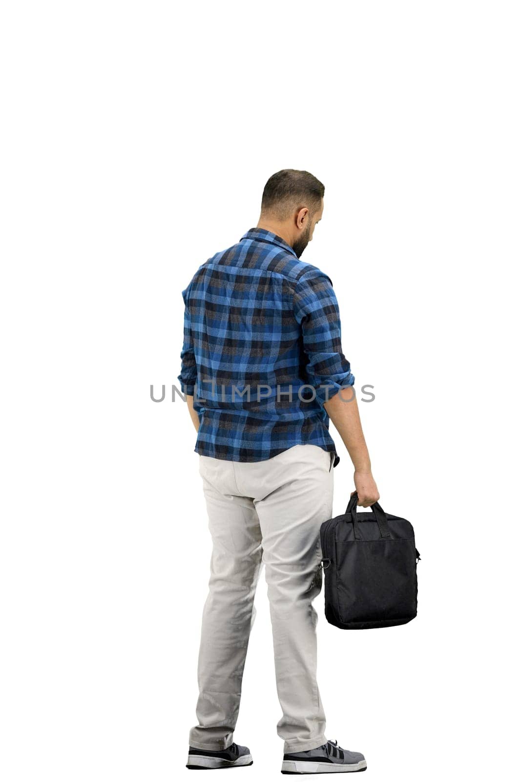 A man, full-length, on a white background, with a briefcase.