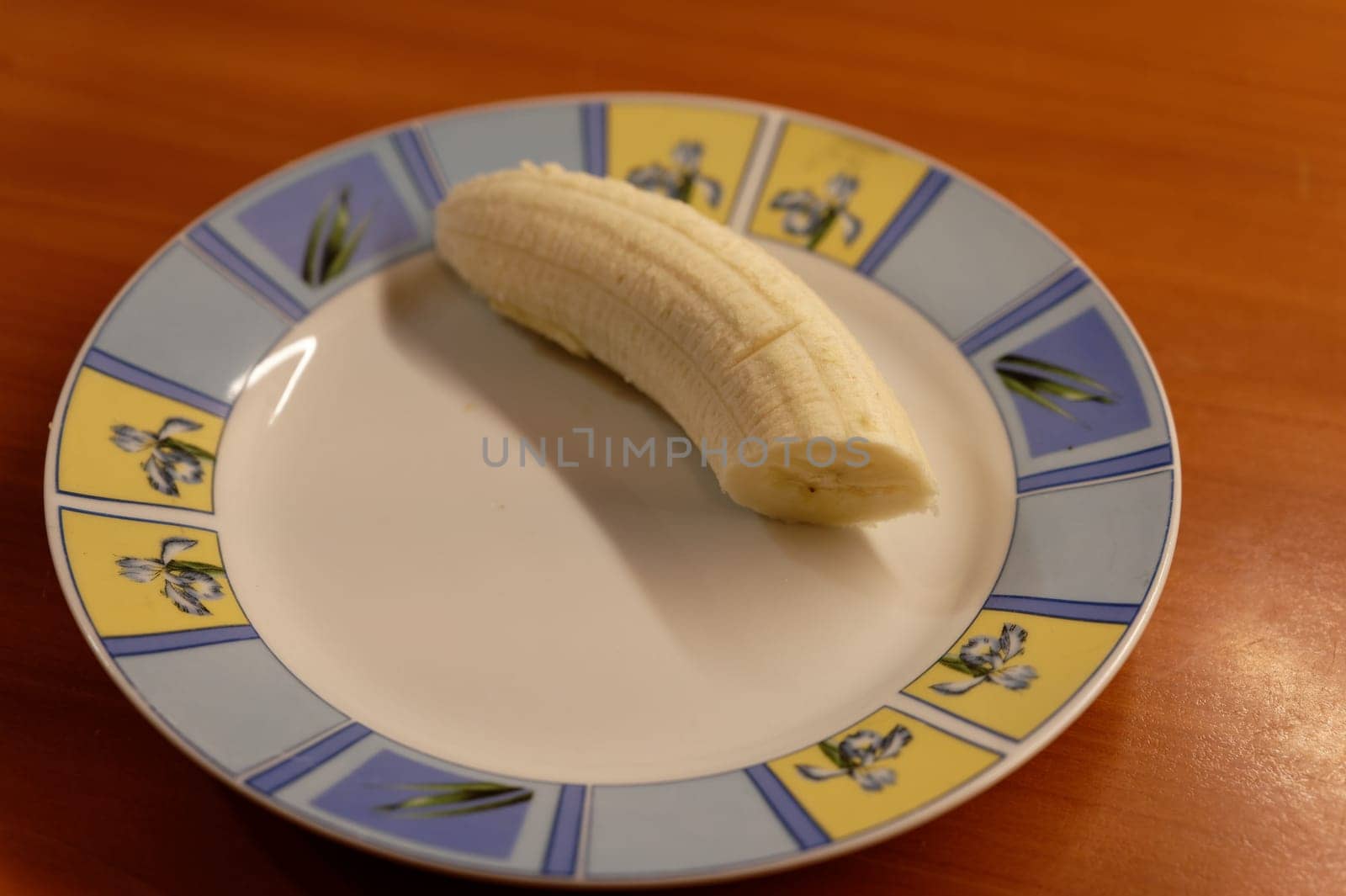 banana on white plate by Montypeter