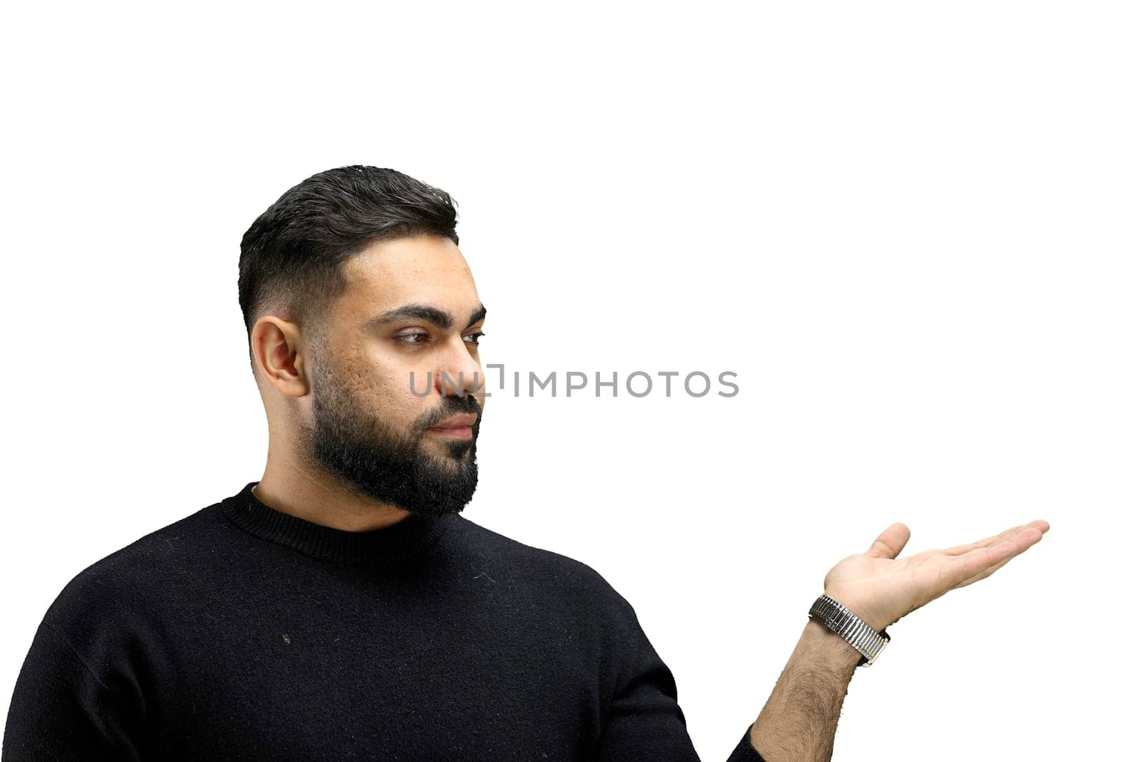 A man, close-up, on a white background, points to the side.