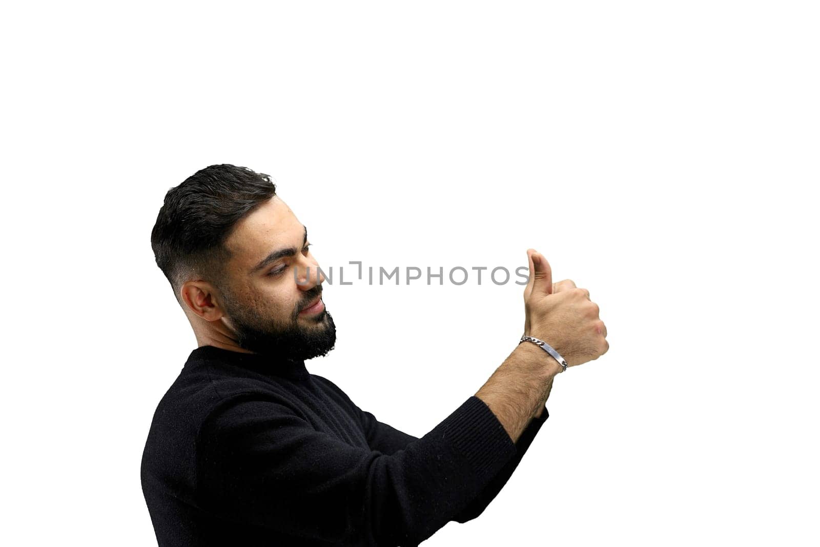 A man, close-up, on a white background, shows his thumbs up.