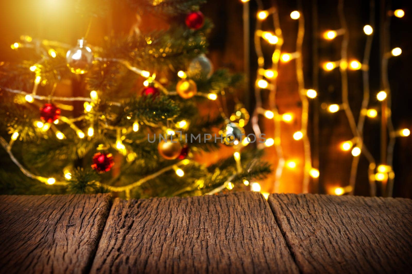 wooden table with fir tree and decorations in the background. Christmas and New Year concept