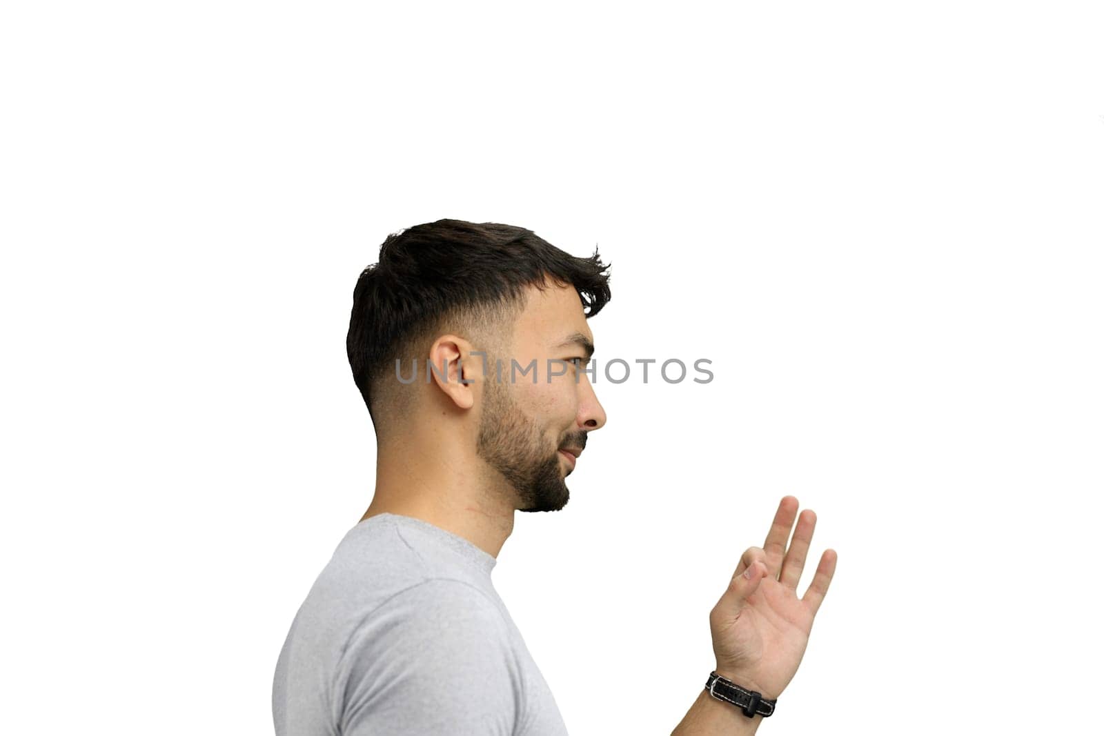 A man, on a white background, in close-up, shows an ok sign by Prosto