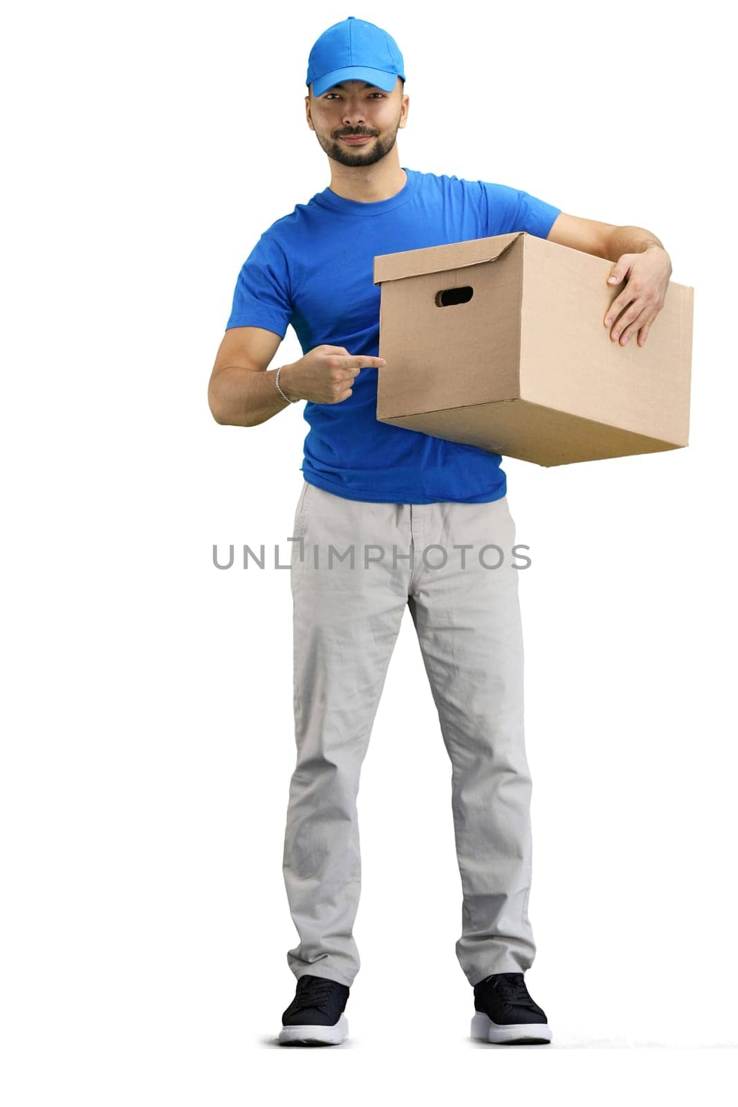 The deliveryman, in full height, on a white background, points to the box.