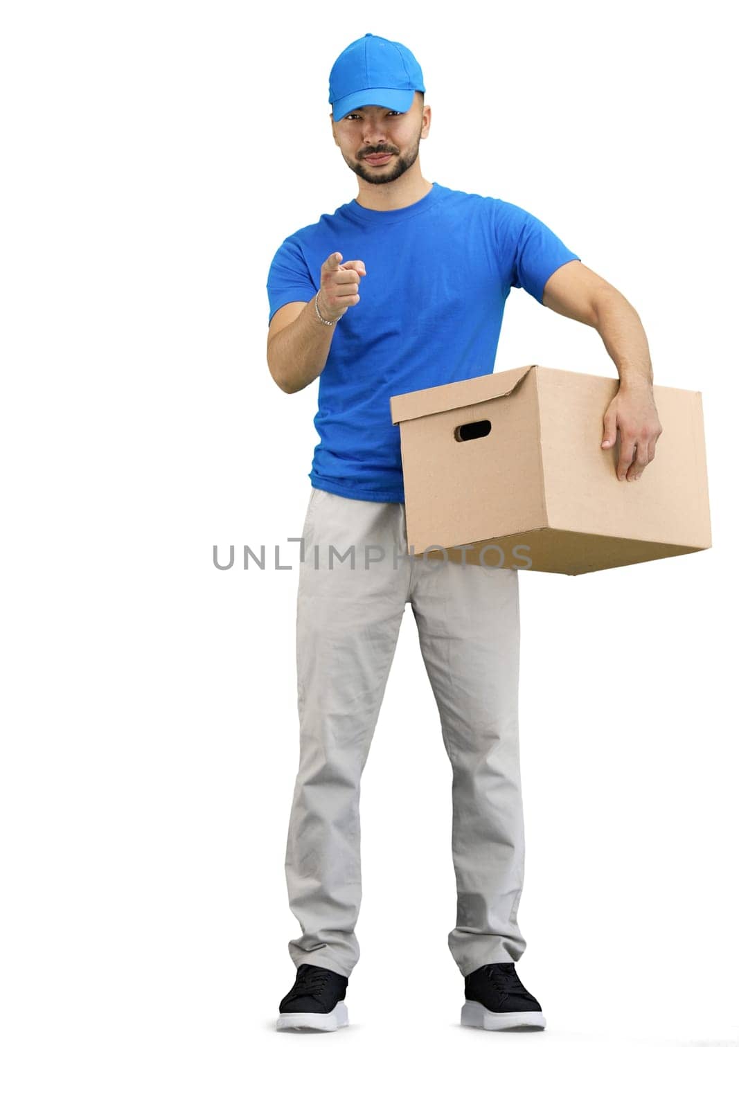 The deliveryman, in full height, on a white background, with a box, points forward by Prosto