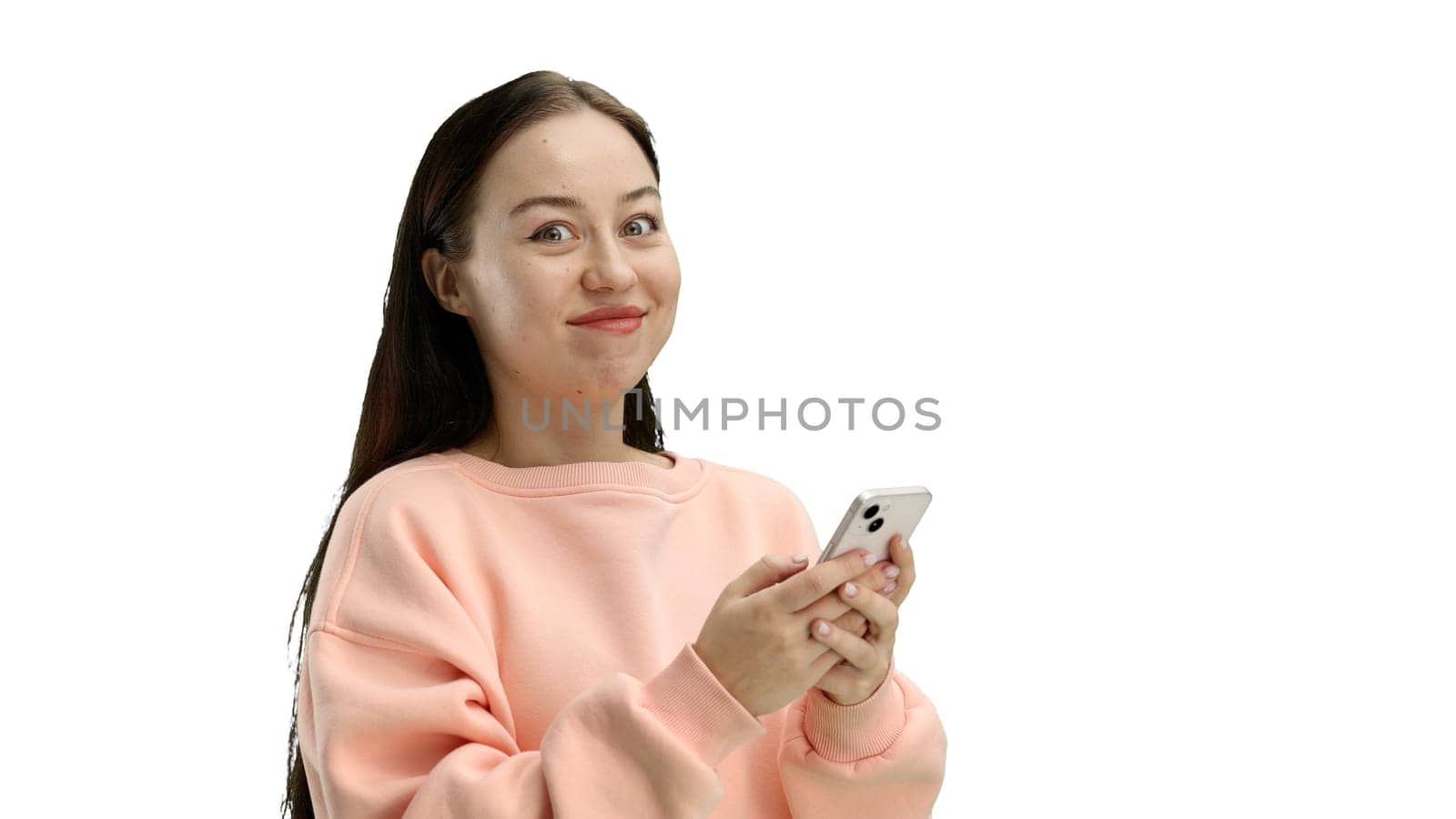 Woman, close-up, on a white background, using a phone.