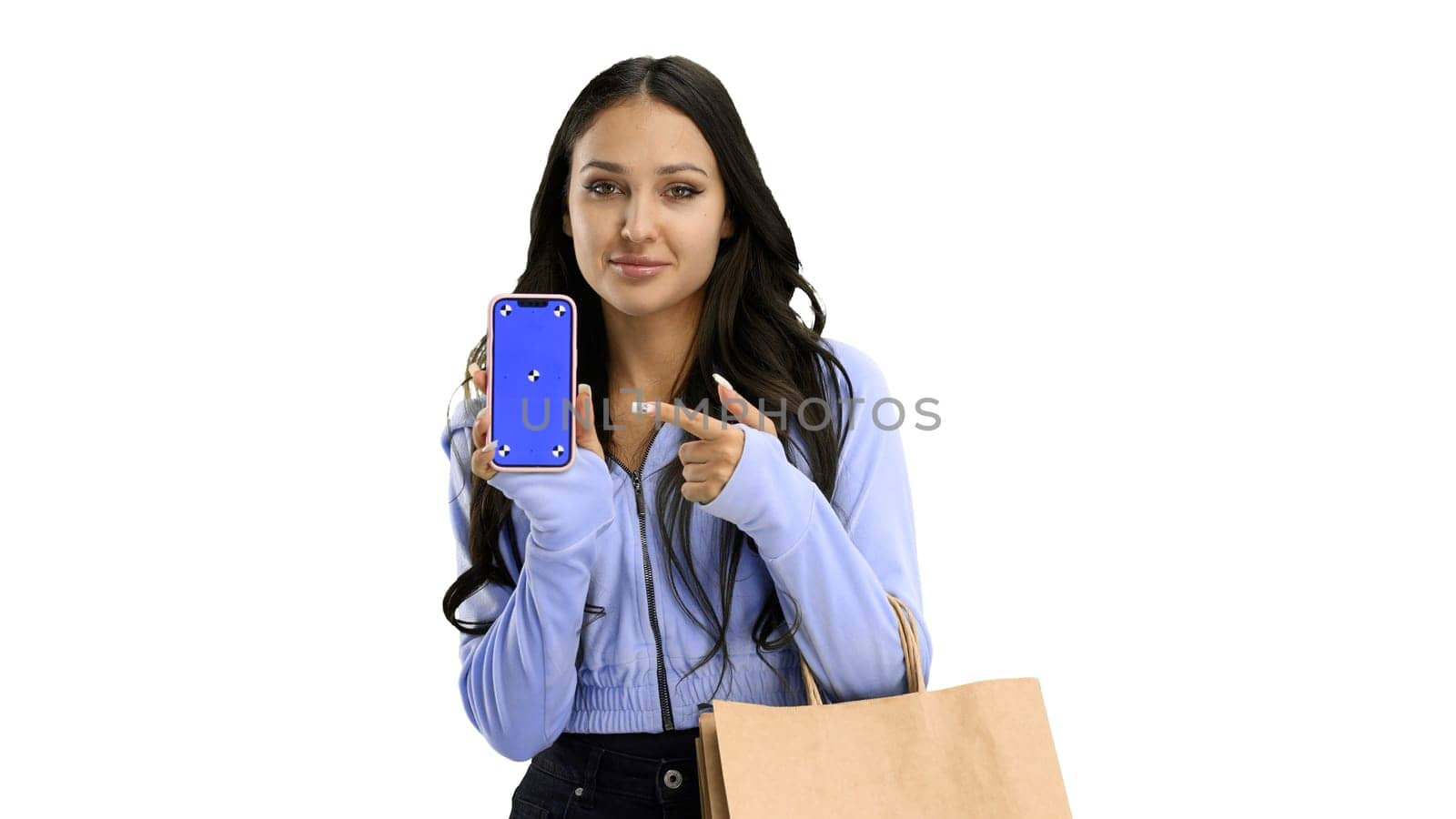 Woman, close-up, on a white background, with bags and a phone.