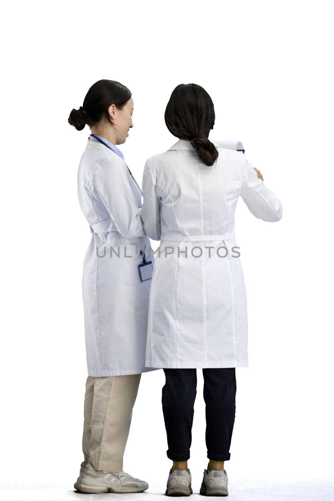 Female doctors, full-length, on a white background, talking by Prosto