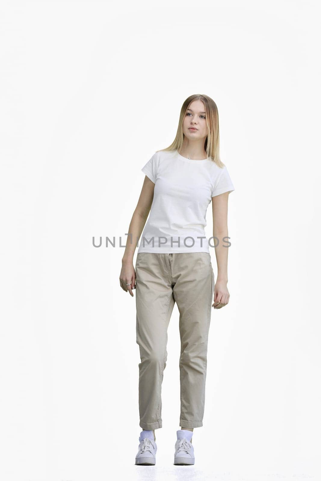 A woman, full-length, on a white background.